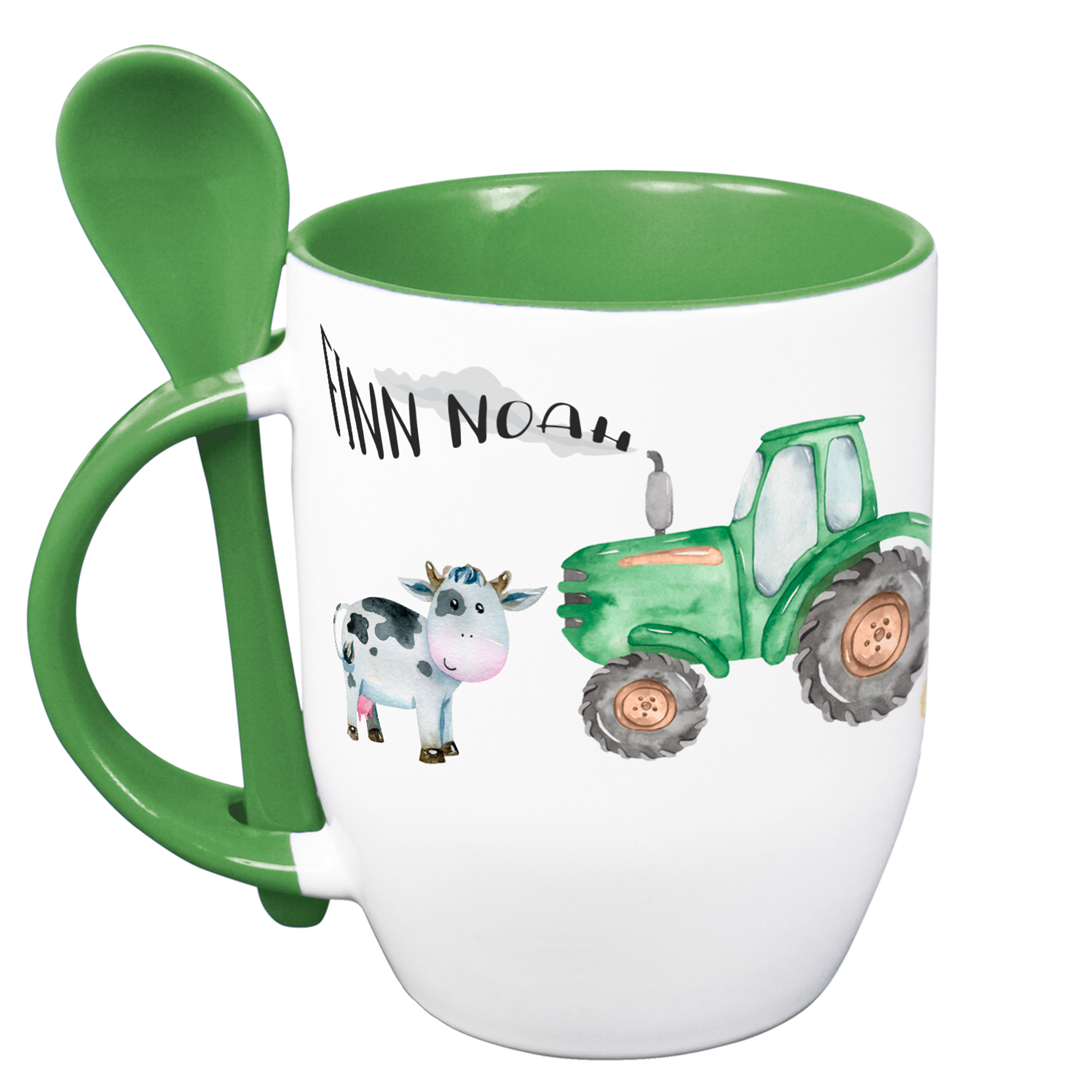 Tasse mit grünem Henkel, Traktor und Kuh-Motiv.