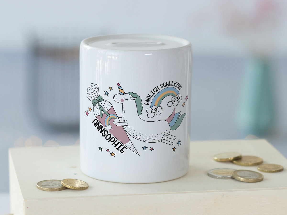 Sparschwein mit Einhorn-Motiv und bunten Details.