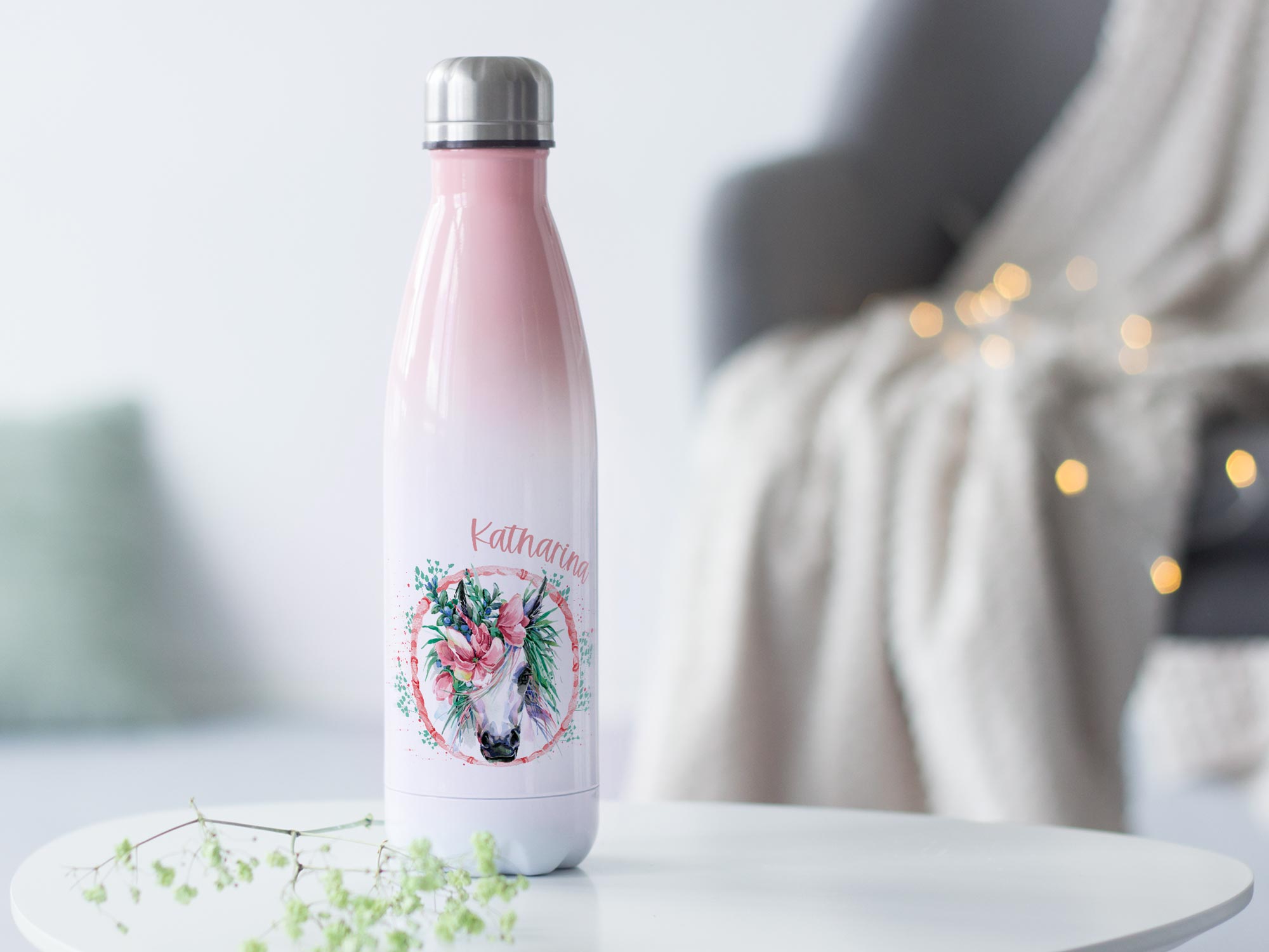 Personalisierte Edelstahl-Trinkflasche in Rosa mit Einhorn-Motiv.