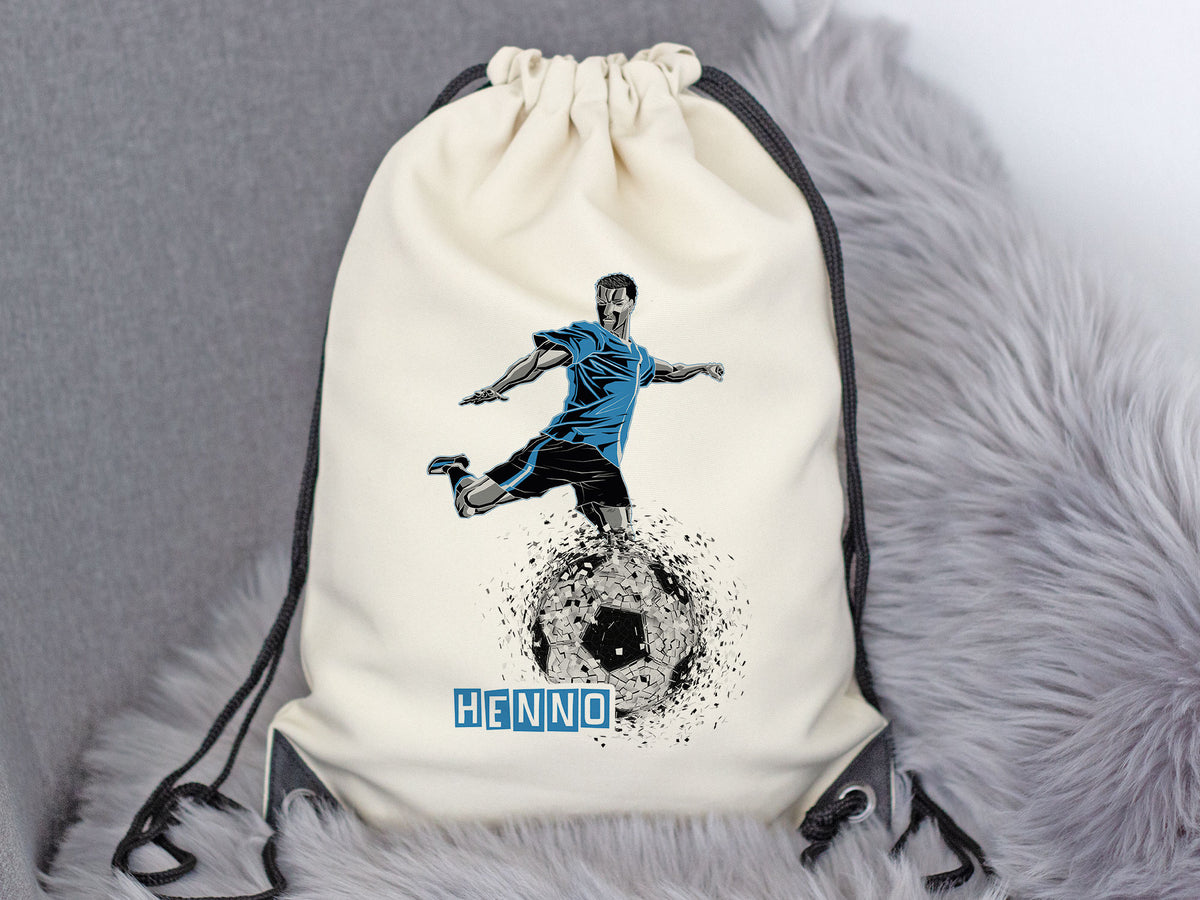 Beige Sportbeutel mit Fußballspieler-Design und blauem Schriftzug.