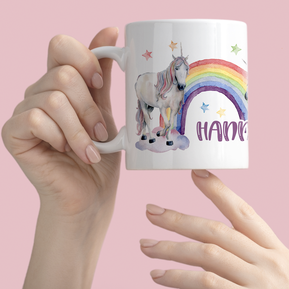 Tasse mit Einhorn, Regenbogen und bunten Sternen.