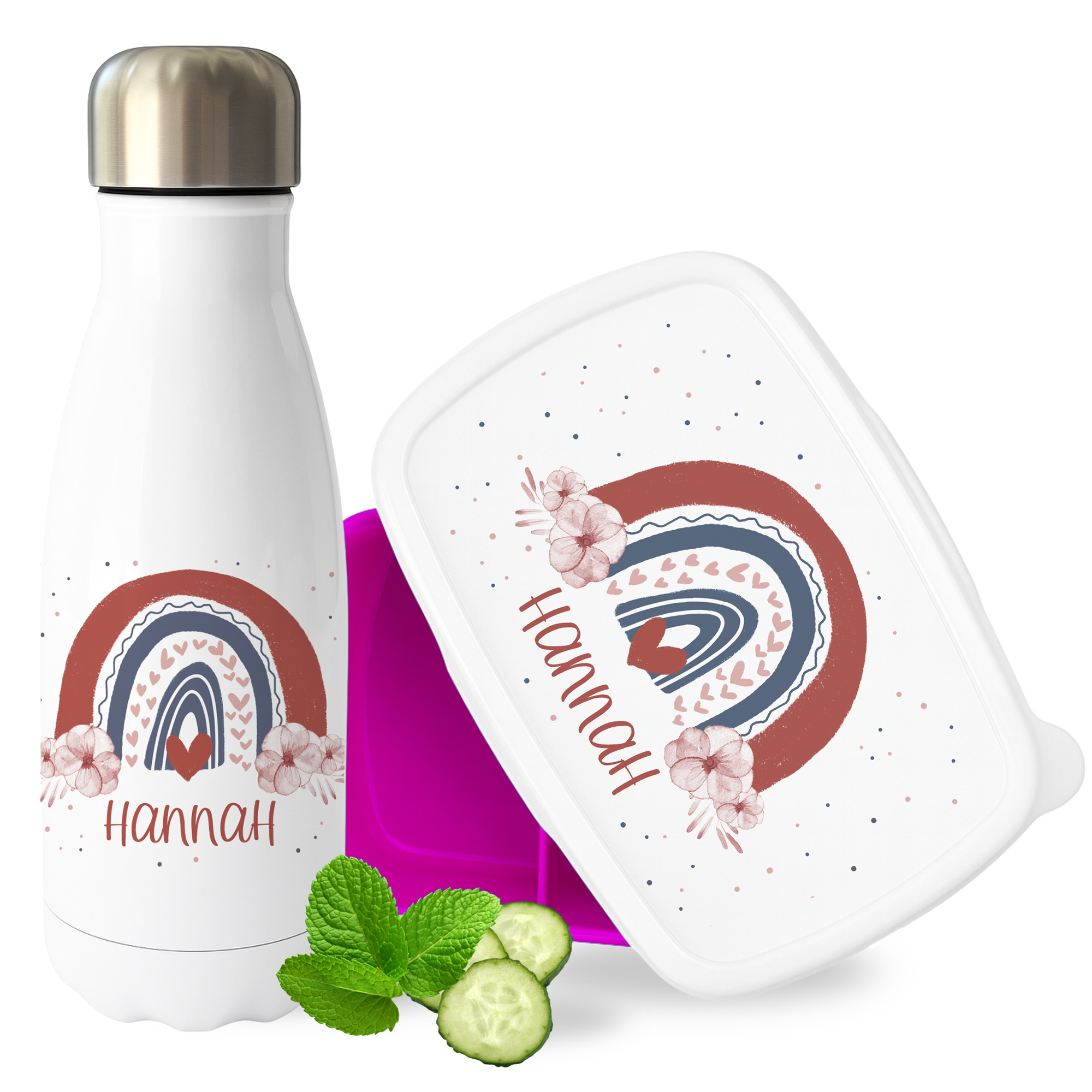 Weiße Trinkflasche und pinke Lunchbox mit Regenbogenmotiv.