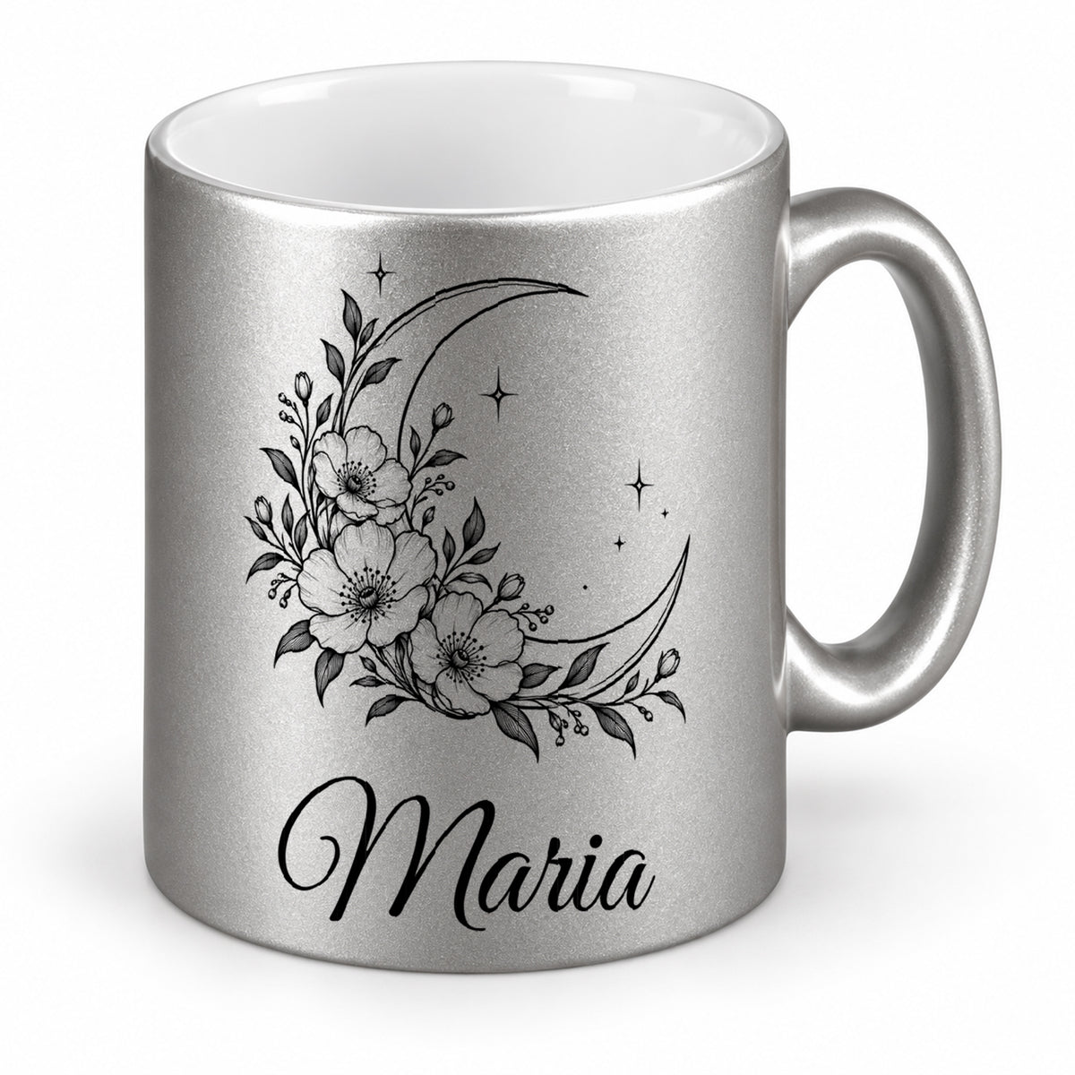 Silberne Tasse mit weißer Innenseite und schwarzem Mond-Blumenmotiv in schräger Ansicht.