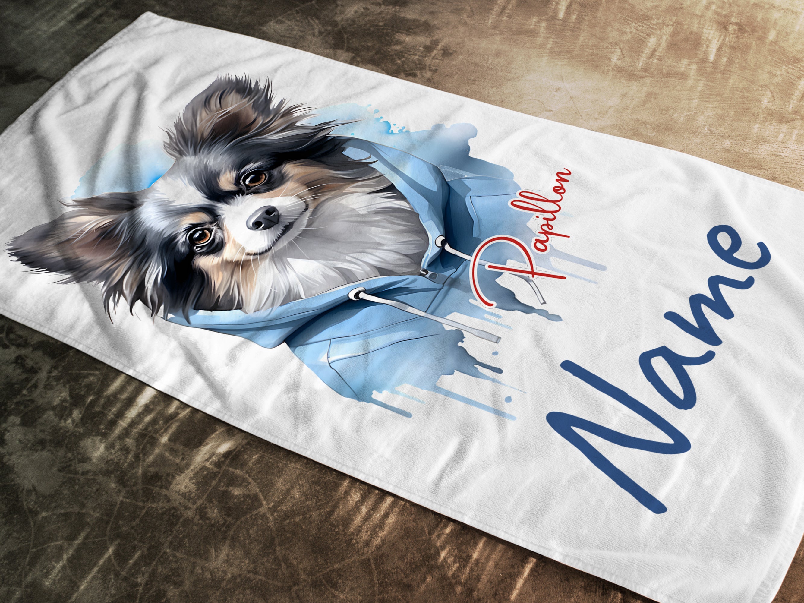 Papillon-Hund mit blauer Kapuze, personalisierbar.