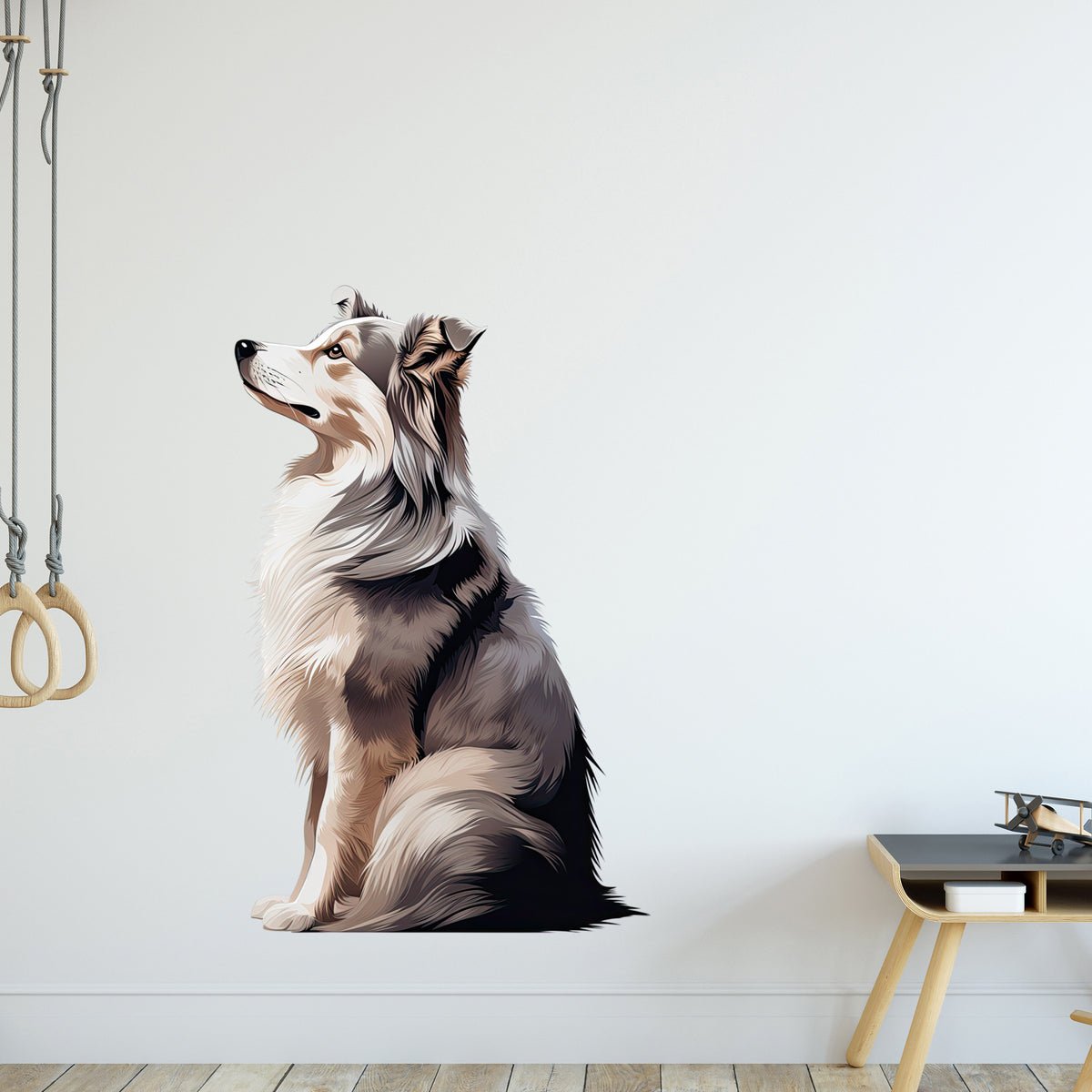 Sitzender Hund in Grau- und Weißtönen, Wandtattoo.