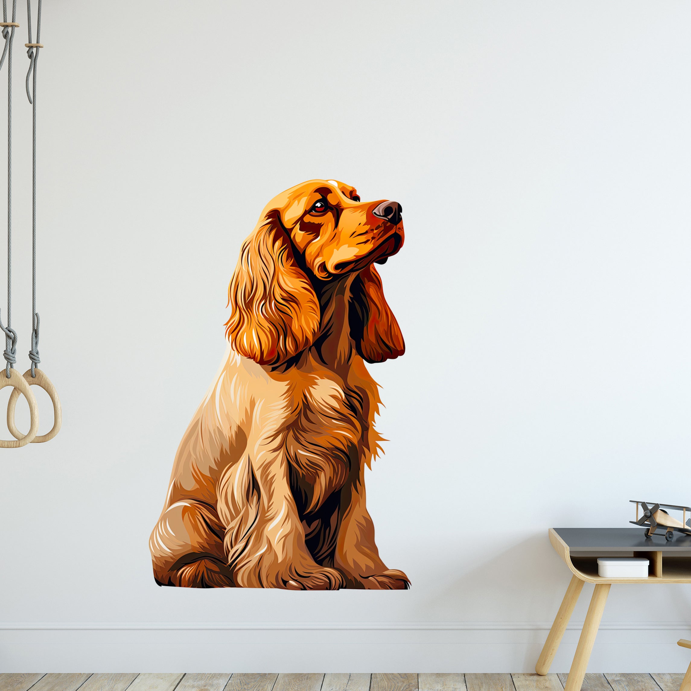Brauner, sitzender Hund mit langen Ohren und seidigem Fell.