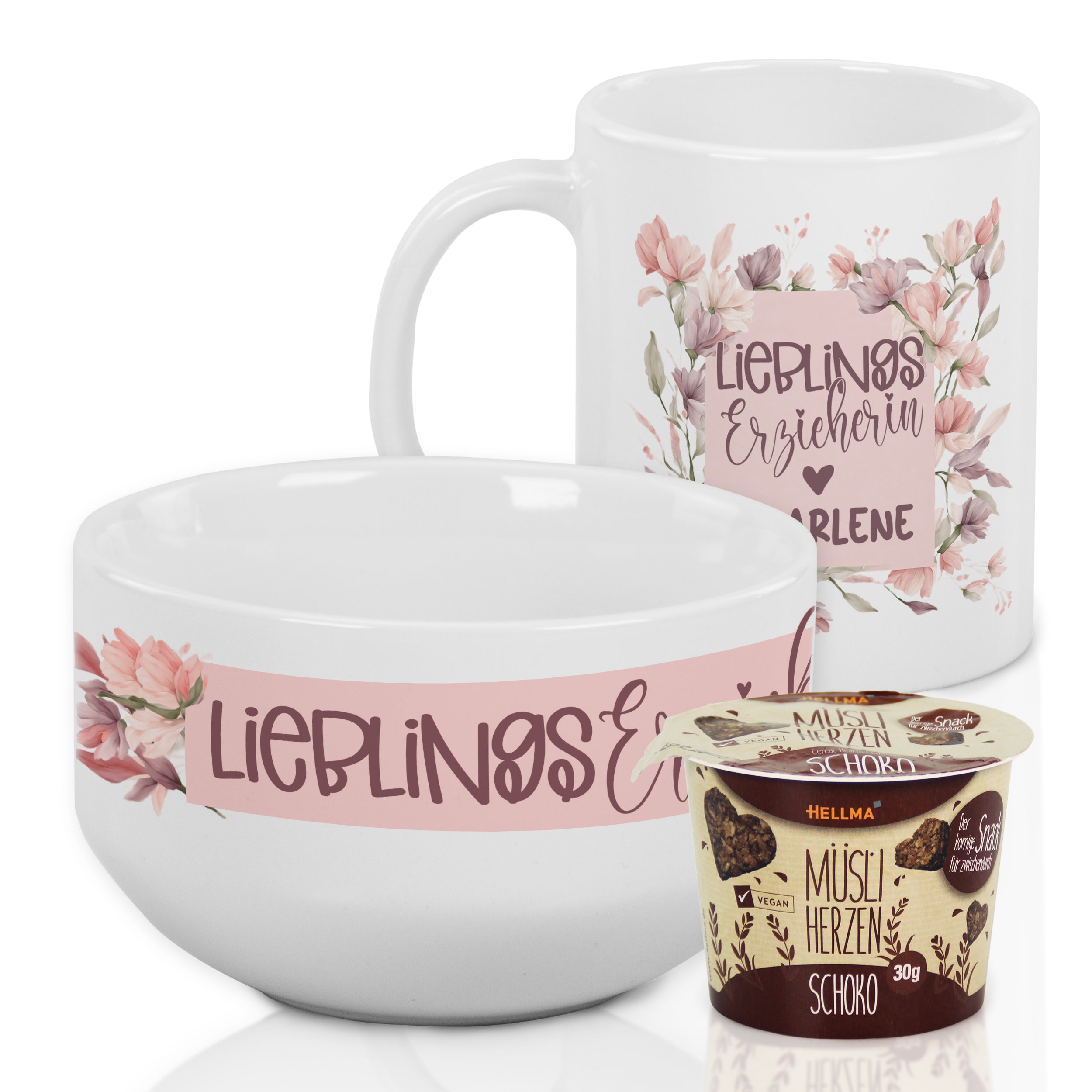 Weißes Geschirrset mit floralen Motiven und Schokolade.
