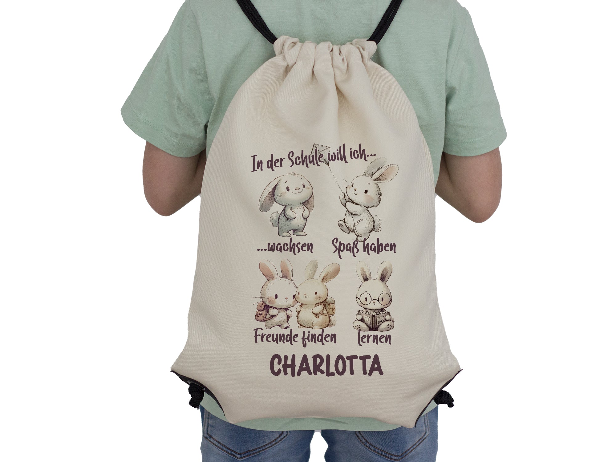 Beige Rucksack mit Hasenmotiven und persönlichem Namen.