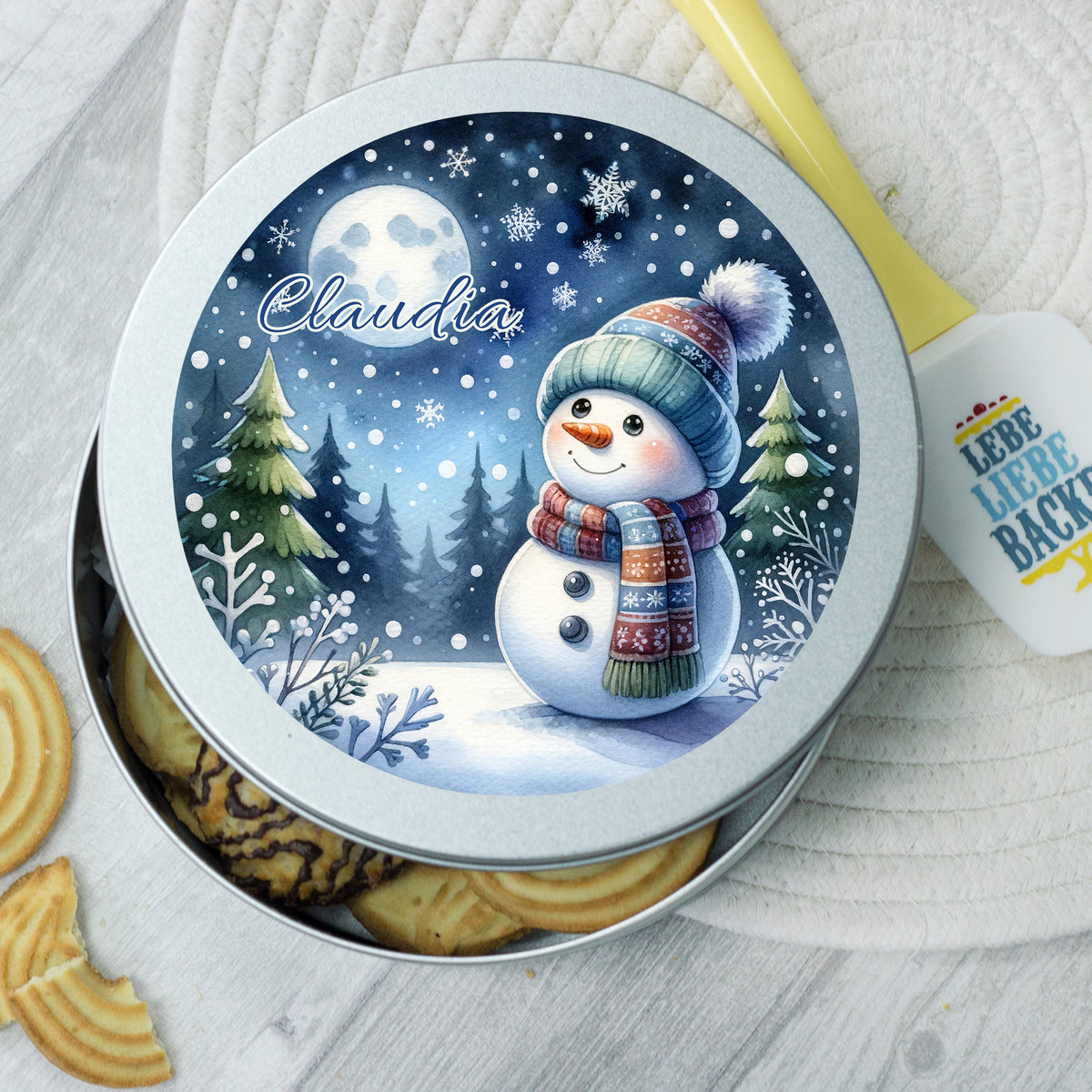 Blechdose mit Schneemann-Design, blau, personalisiert mit "Claudia".