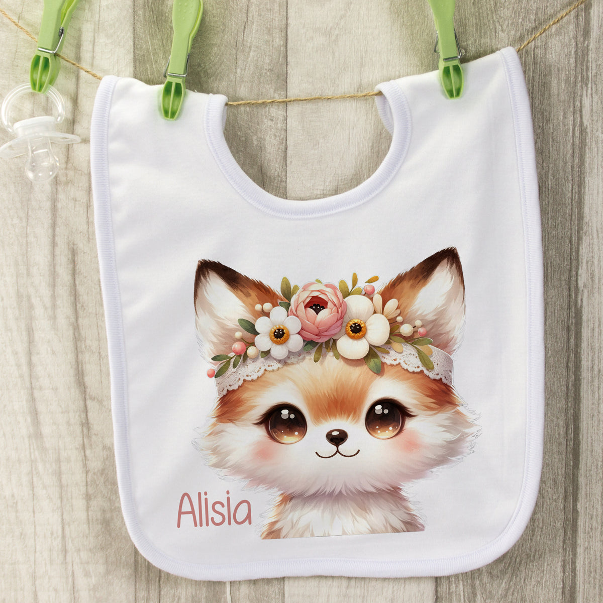 Lätzchen mit niedlichem Fuchs-Motiv und Blumenkranz.