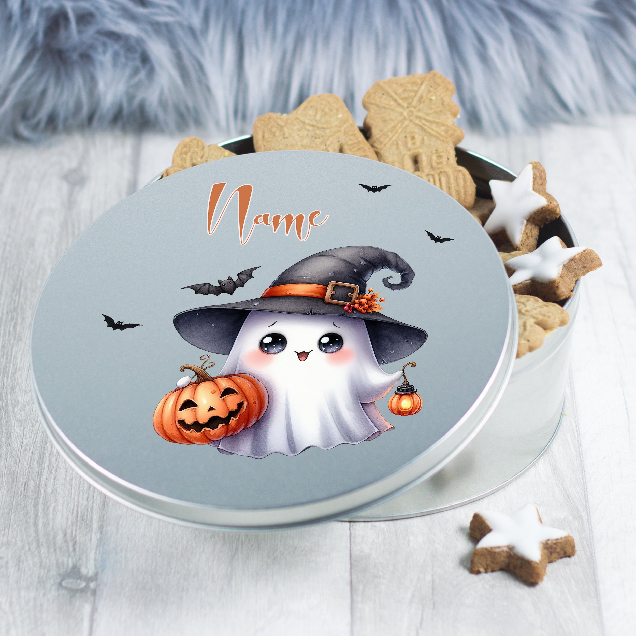 Geschenkdose mit süßem Gespenst, Kürbis und Halloween-Motiv.