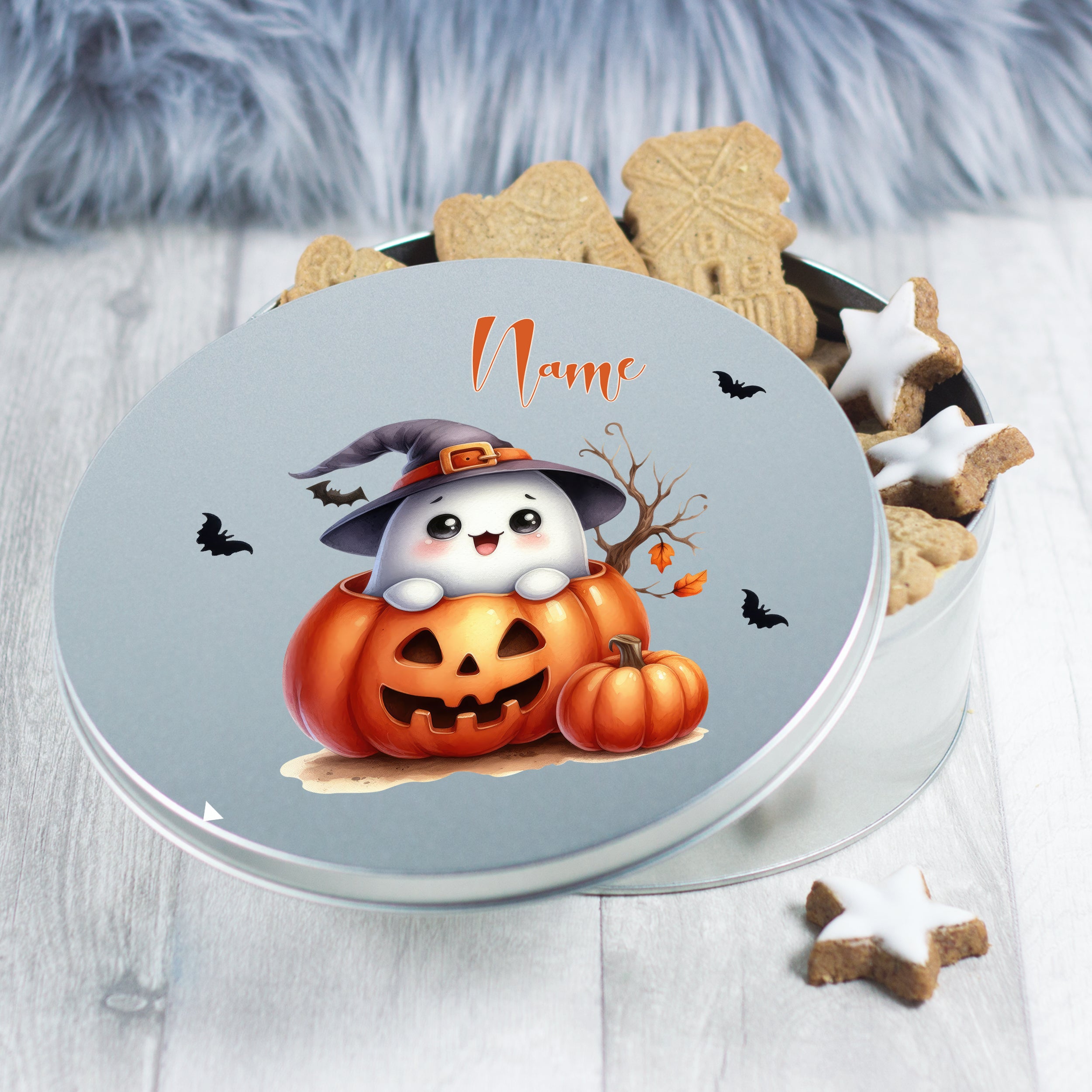 Runde Keksdose mit Halloween-Motiv, Kürbis und Gespenst.