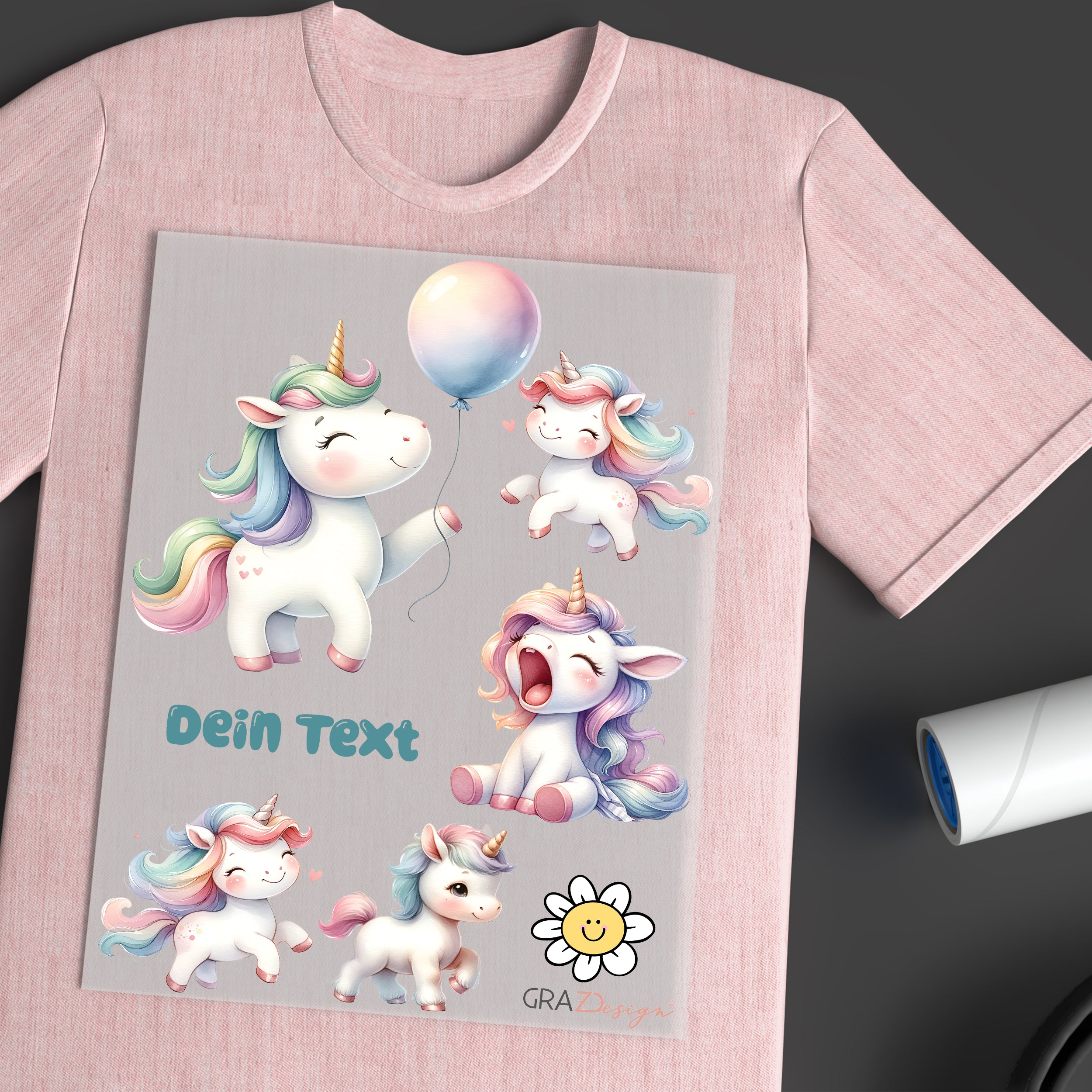 Rosa T-Shirt mit bunten Einhörnern und Text.