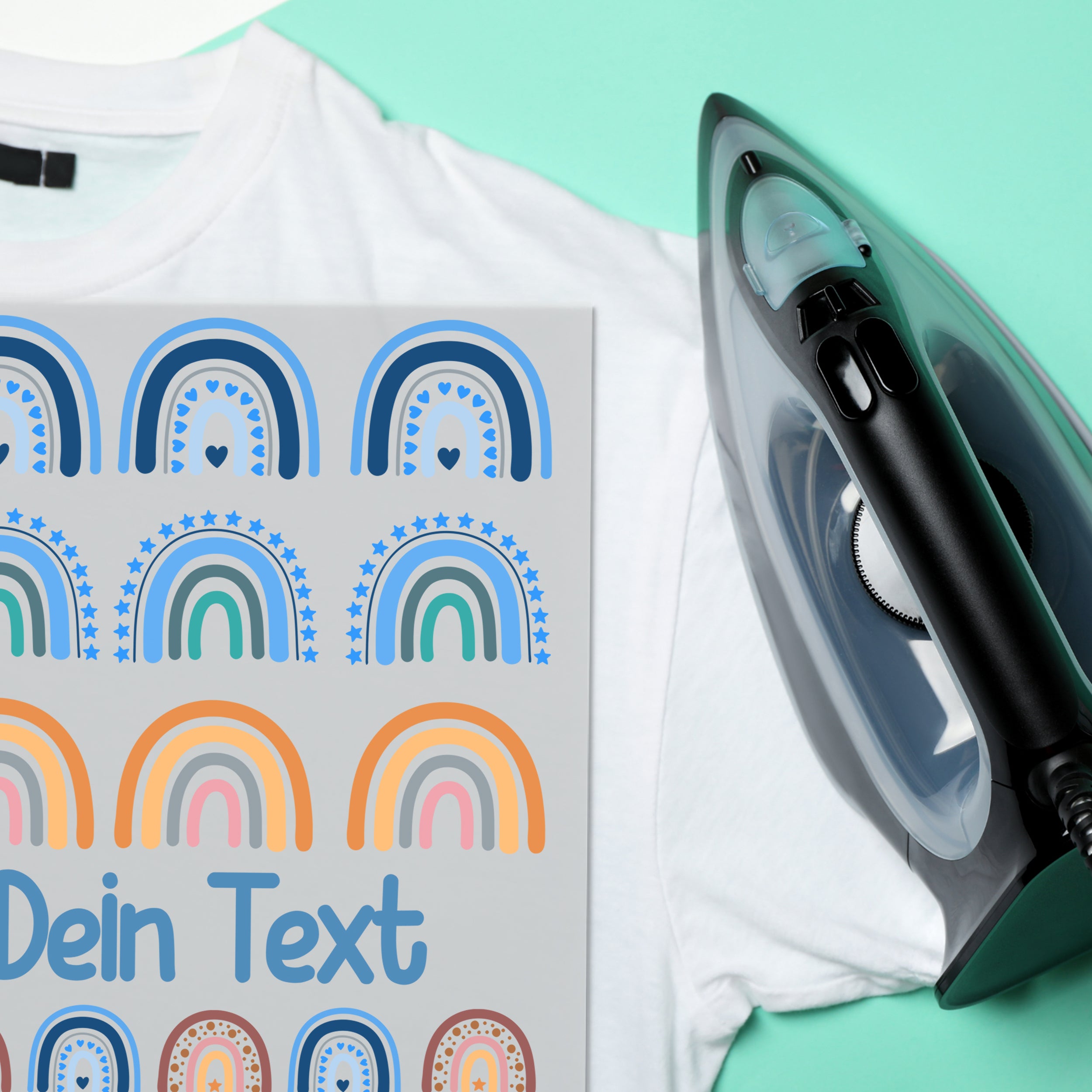 Weißes T-Shirt mit buntem Regenbogen-Design und Bügeleisen.