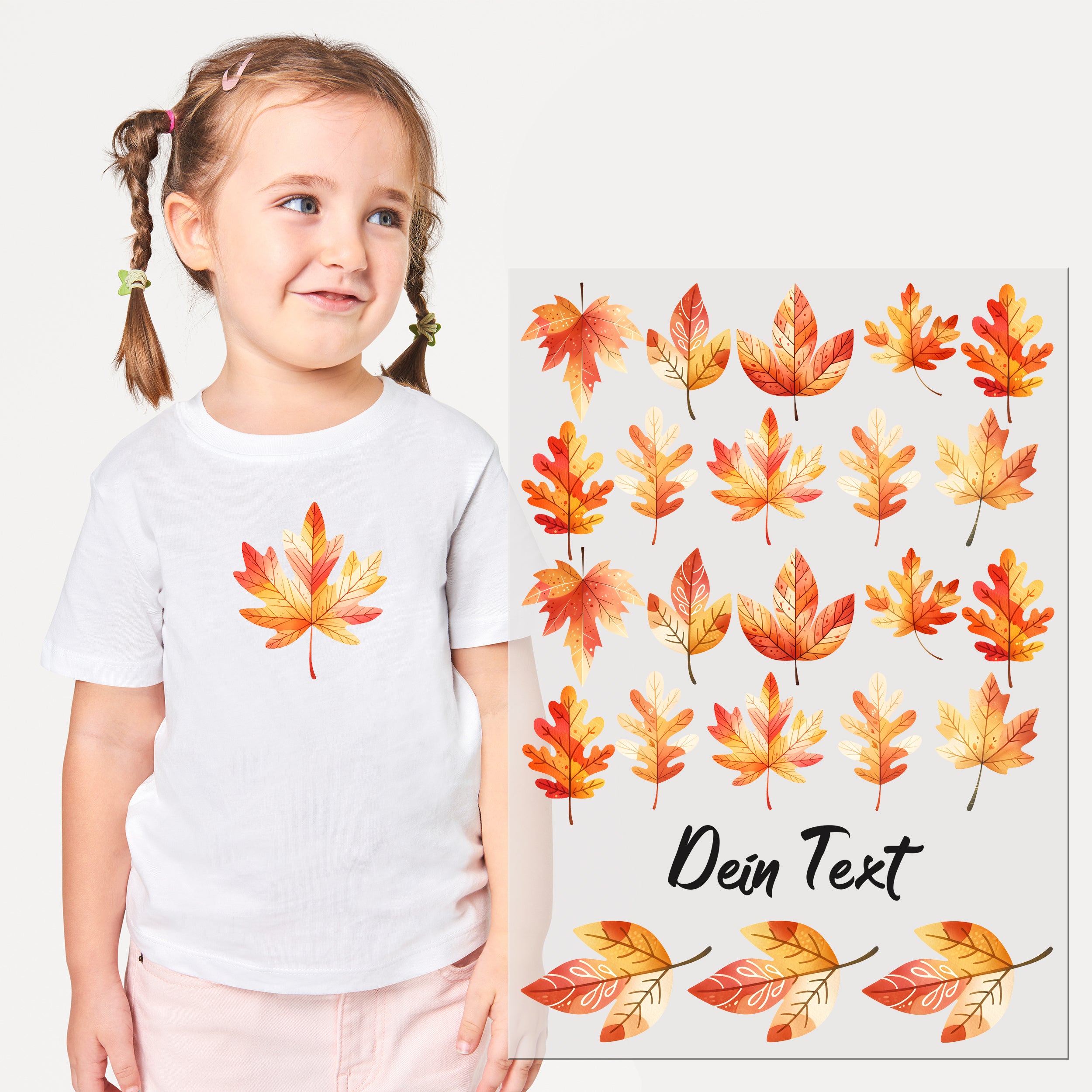 Weißes T-Shirt mit bunten Herbstblättern und Text.