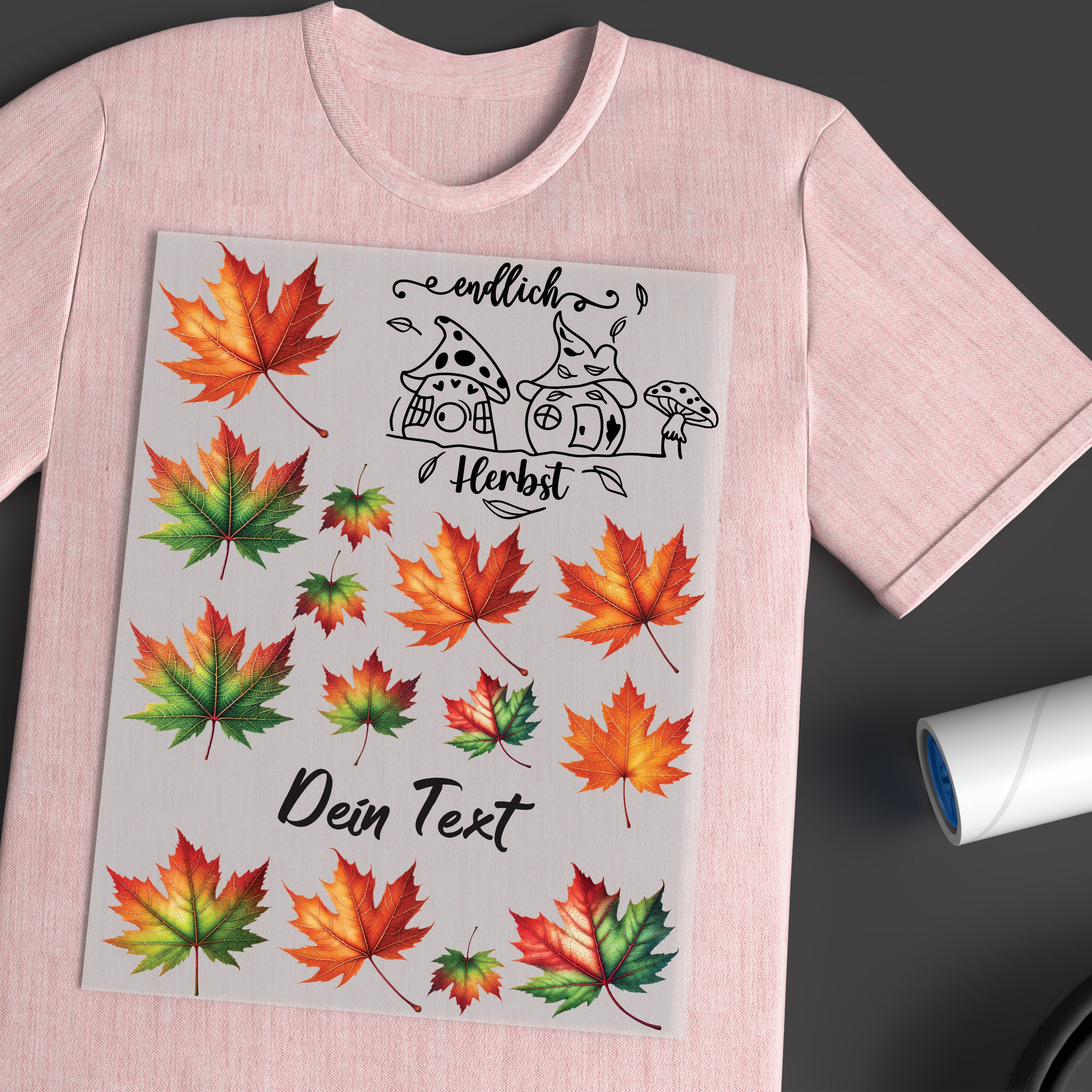 Rosa T-Shirt mit bunten Herbstblättern und Text.