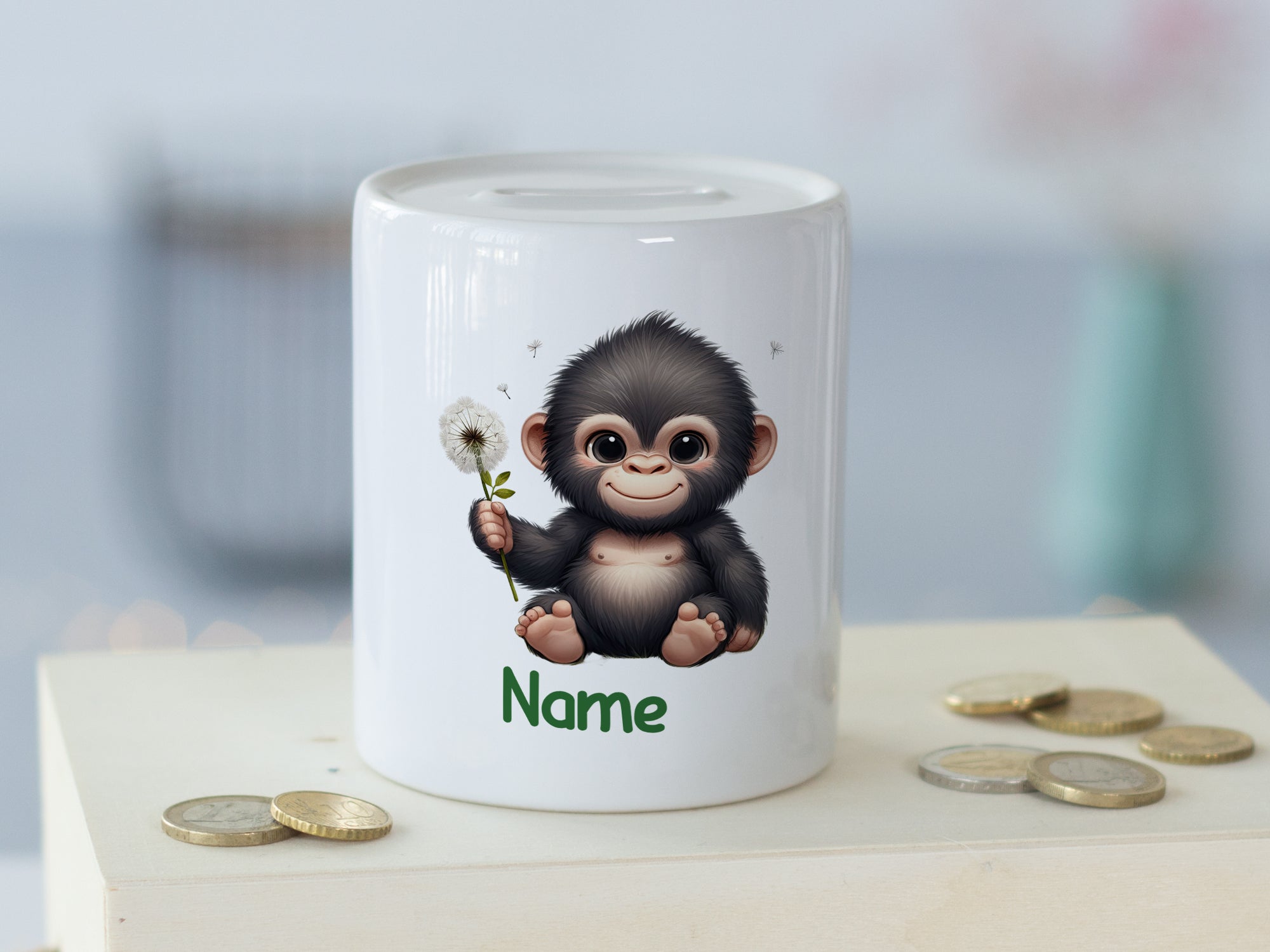 Sparschwein mit niedlichem Affenmotiv und personalisierbarem Namen.