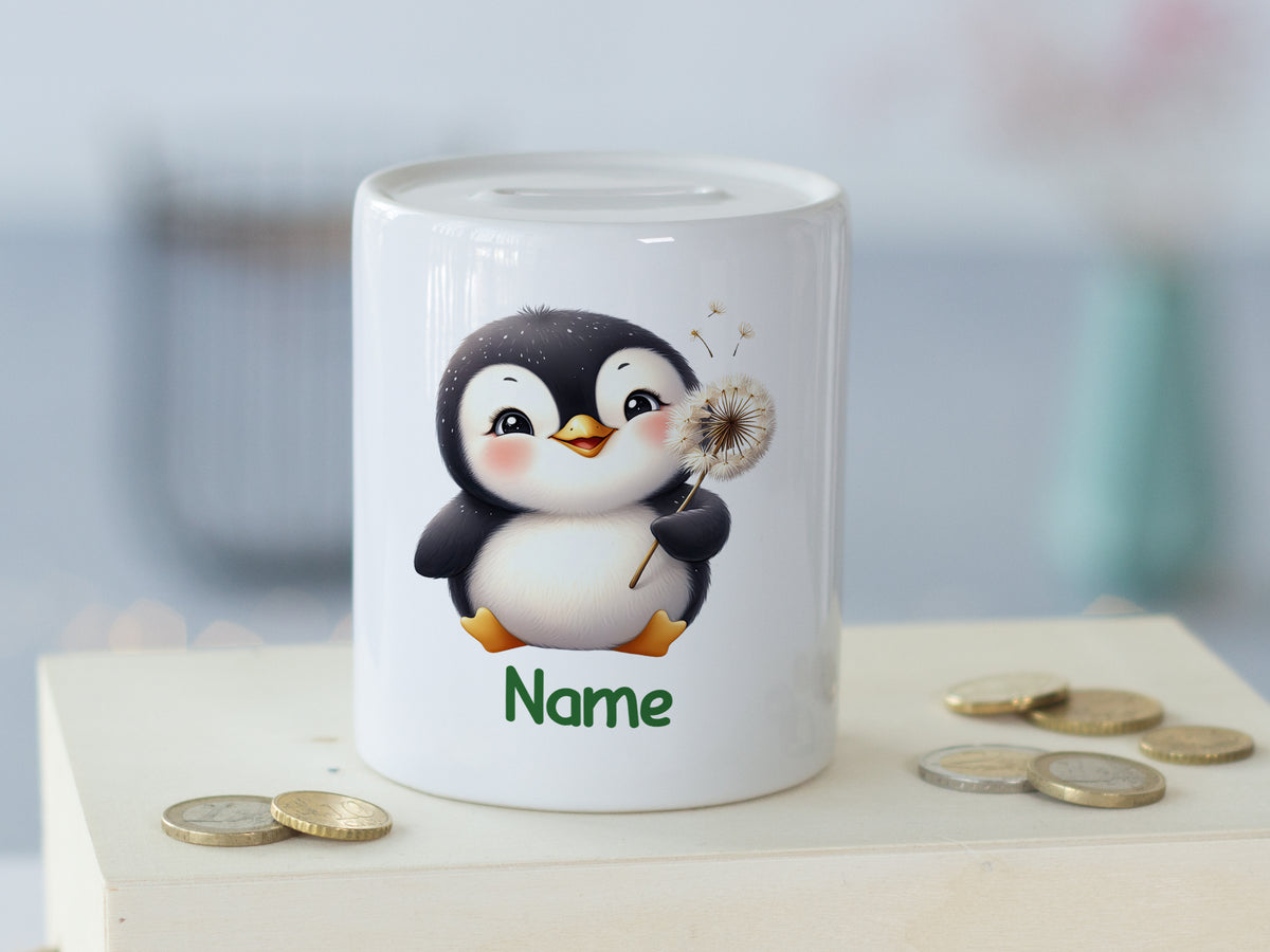 Sparschwein mit Pinguin-Motiv und personalisierbarem Namen.