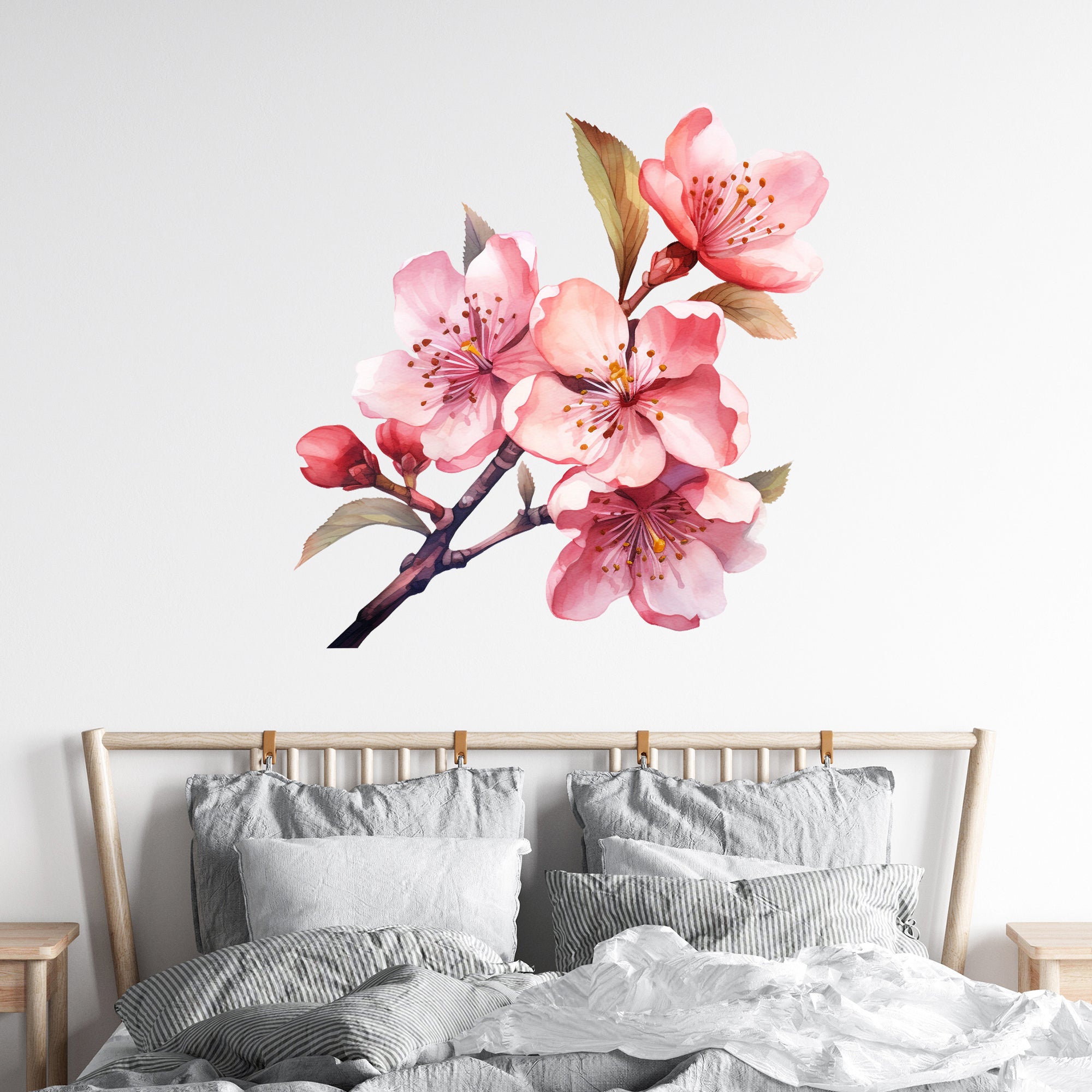 Wandtattoo mit rosa Kirschblüten über einem Bett