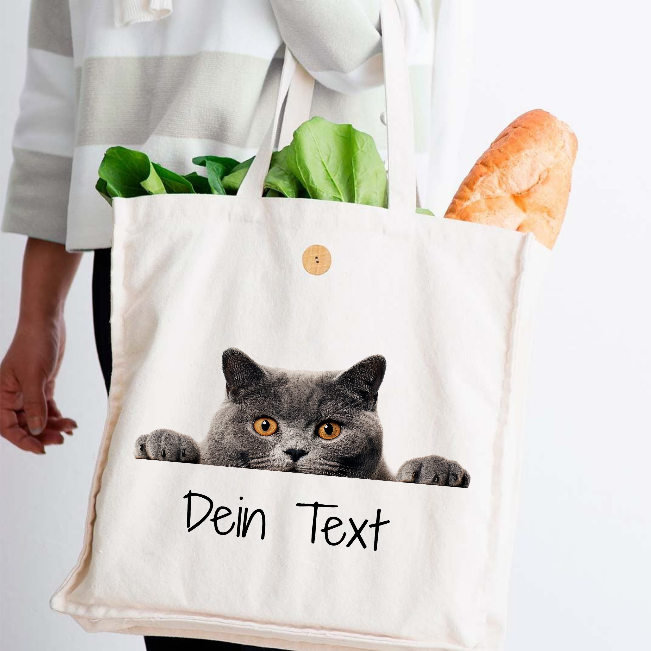 Beige Stofftasche mit grauem Katzenmotiv und Text.
