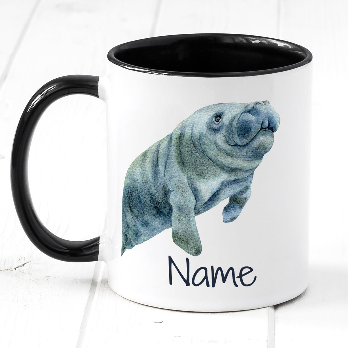 Tasse mit schwarzem Henkel, Manati-Motiv und Platz für Namen