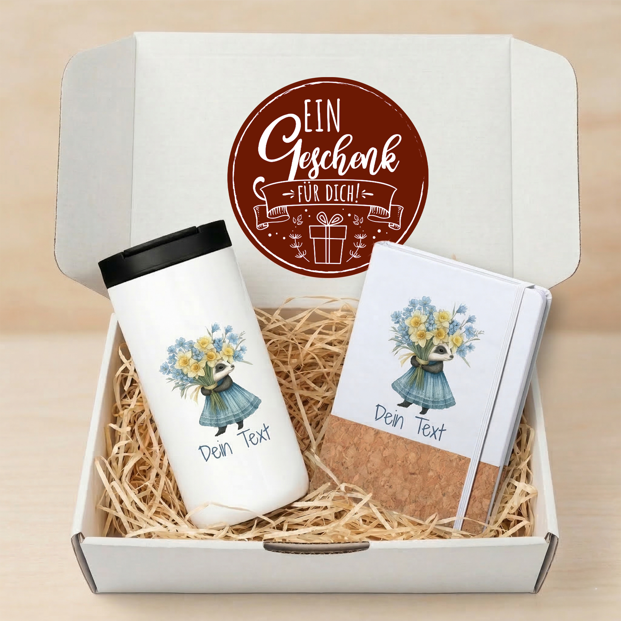 Weißer Becher und Notizbuch mit Blumenmotiv, personalisierbar.