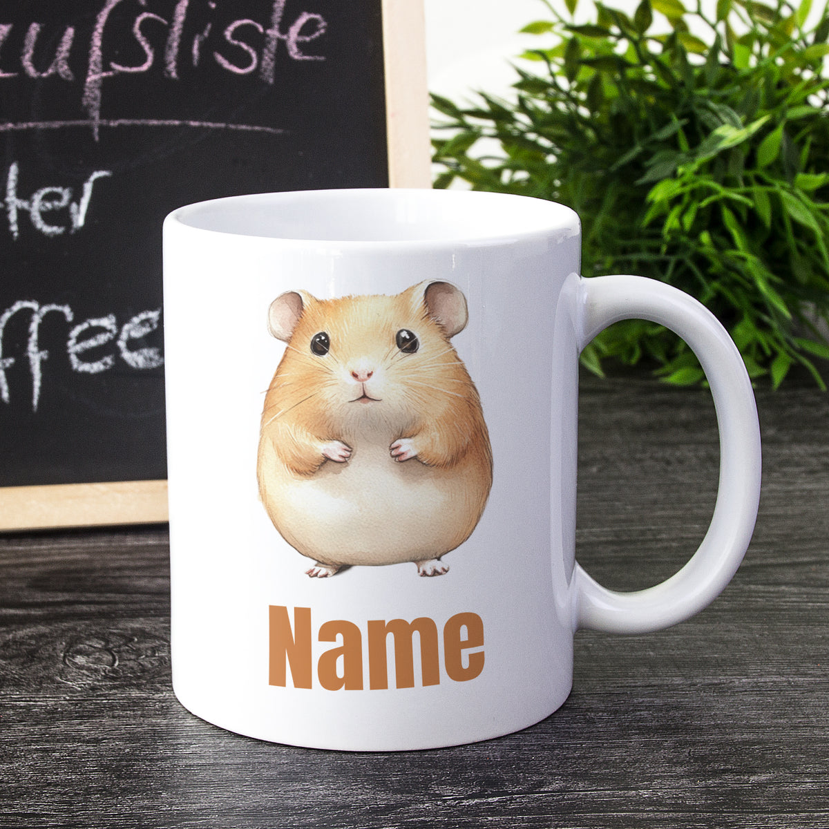 Weißer Kaffeebecher mit Hamster-Motiv und personalisierbarem Namen.