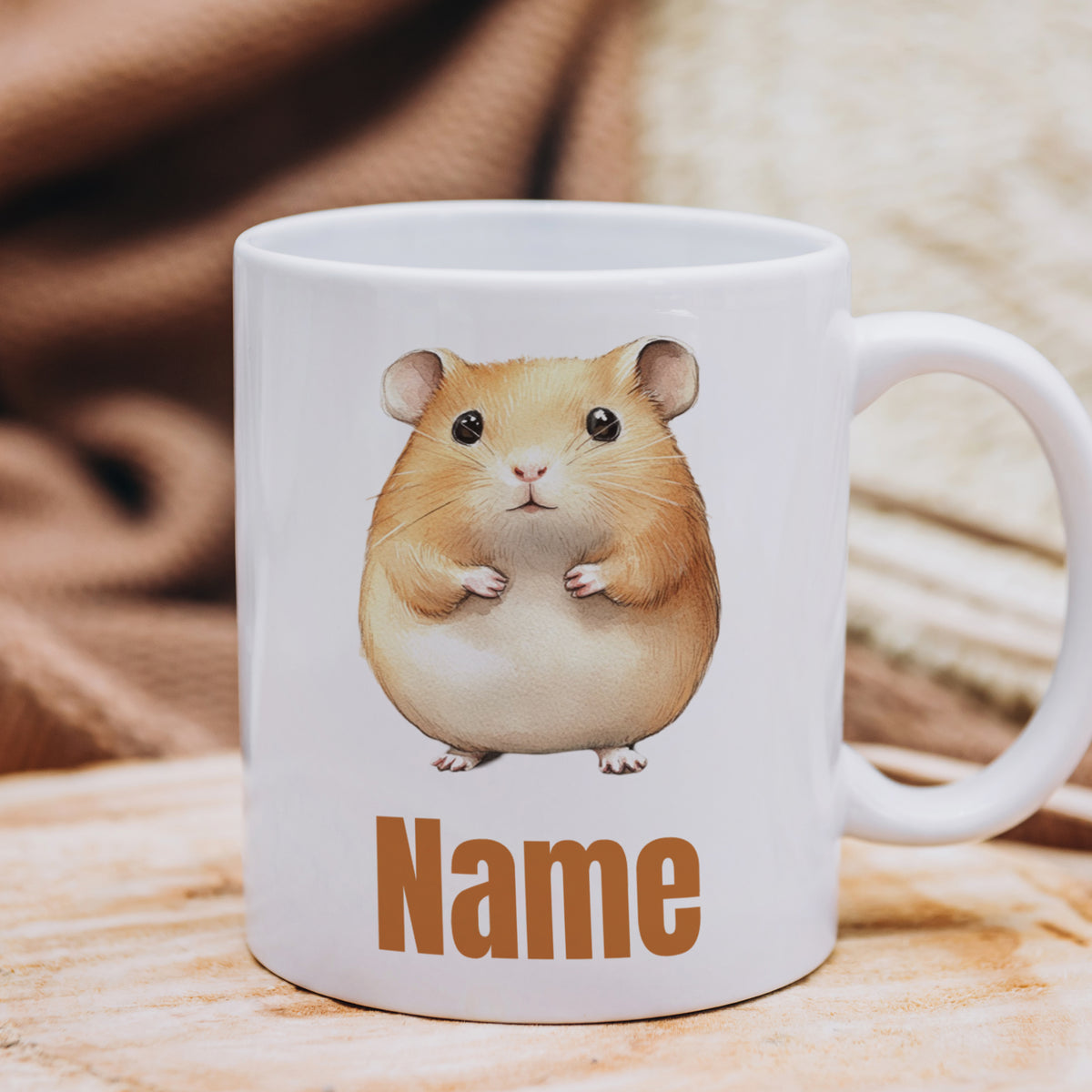 Weiße Tasse mit Hamster-Illustration und "Name"-Aufschrift.