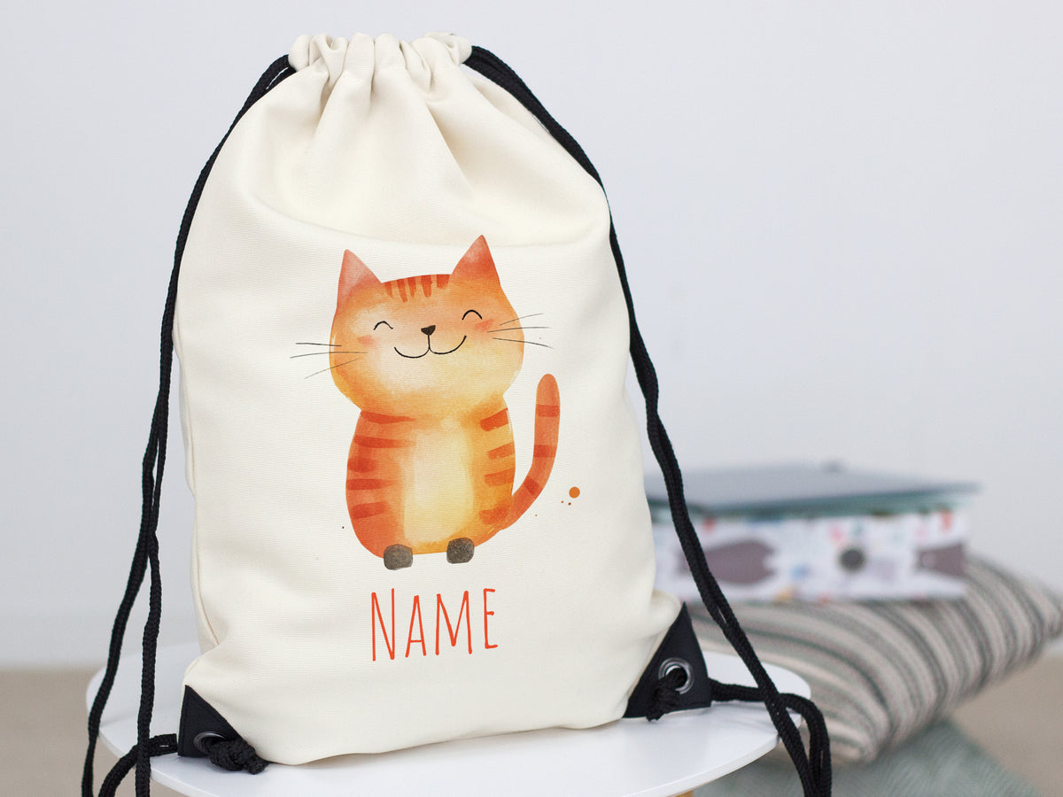 Beige Rucksack mit orangefarbenem Katzenmotiv und Platz für Namen.