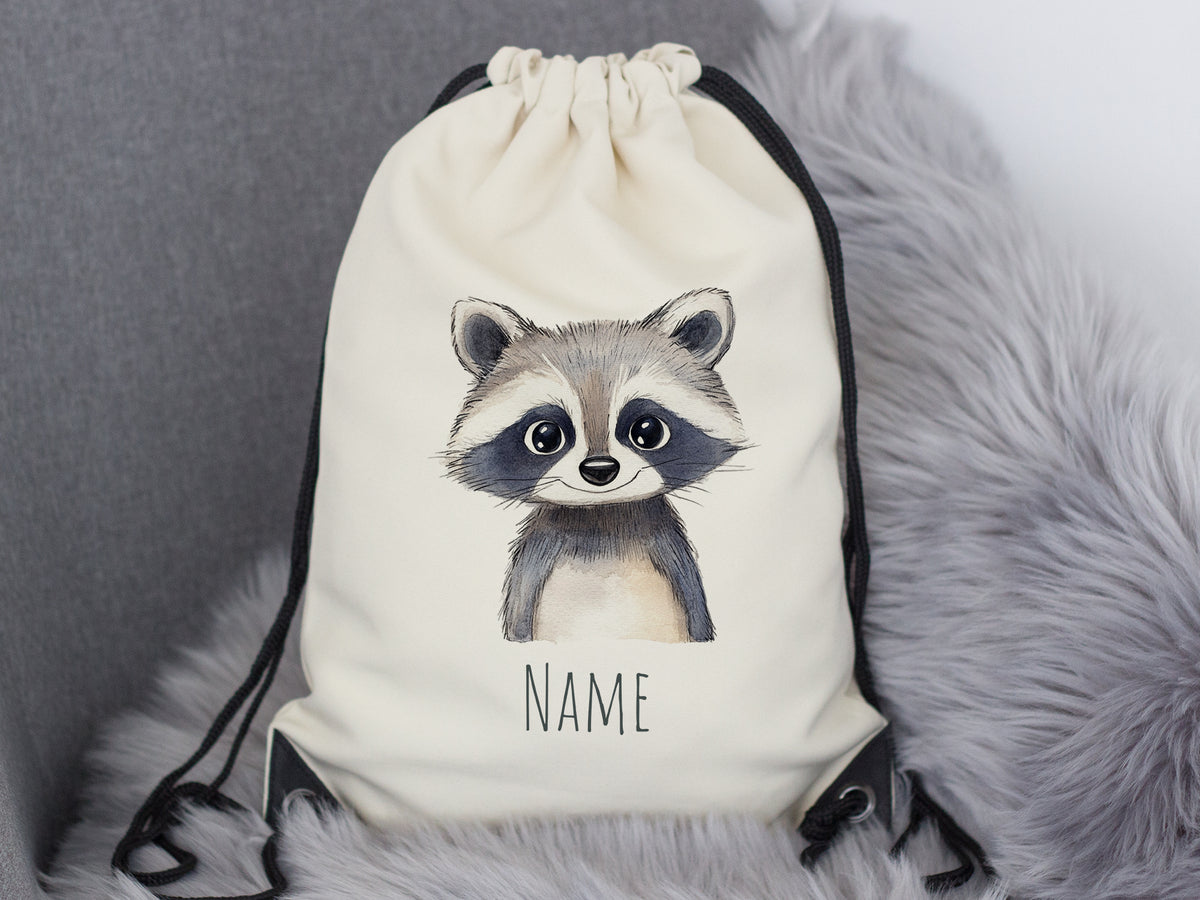 Beige Rucksack mit niedlichem Waschbären-Motiv und Platz für Namen.