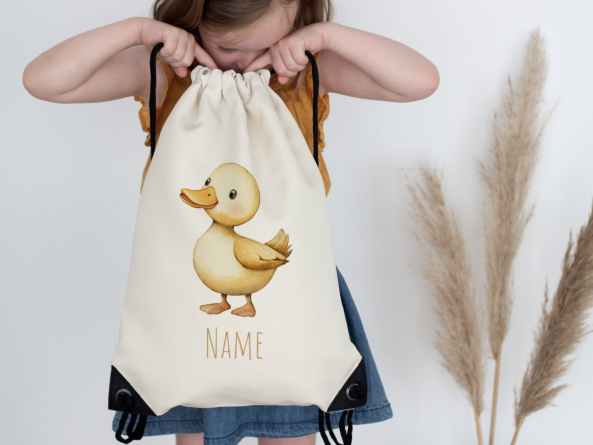 Beige Rucksack mit Entenmotiv und Platz für Namen