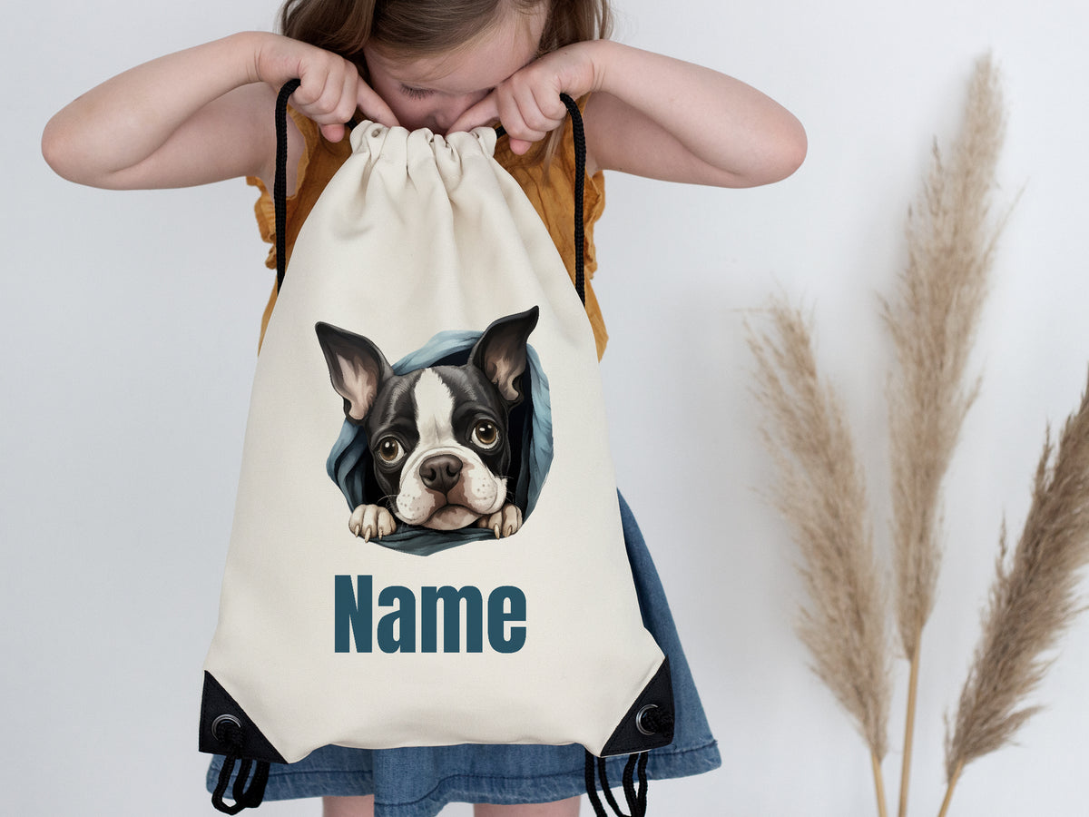 Beige Turnbeutel mit Hundemotiv und personalisierbarem Namen.