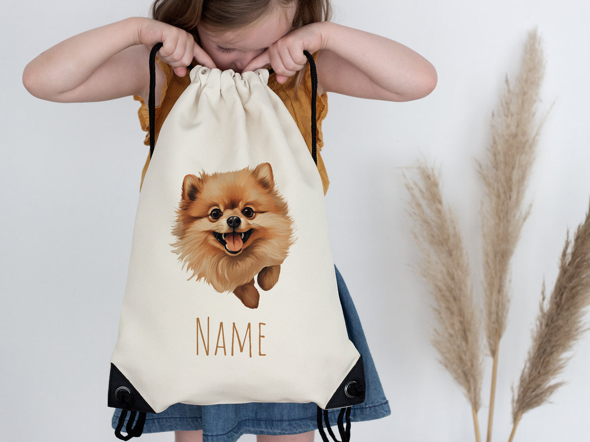 Beige Rucksack mit Pomeranian-Motiv und Platz für Namen.