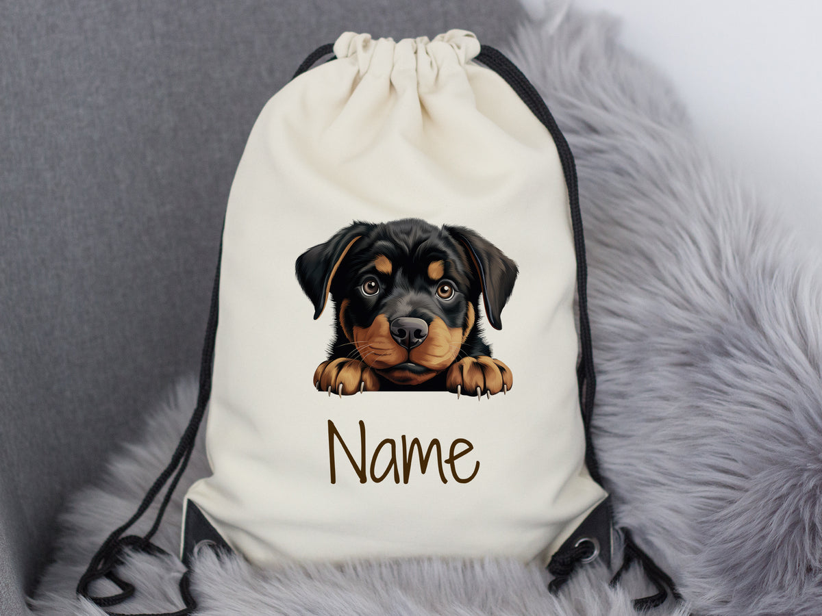 Beige Rucksack mit Rottweiler-Motiv und Platz für Namen.