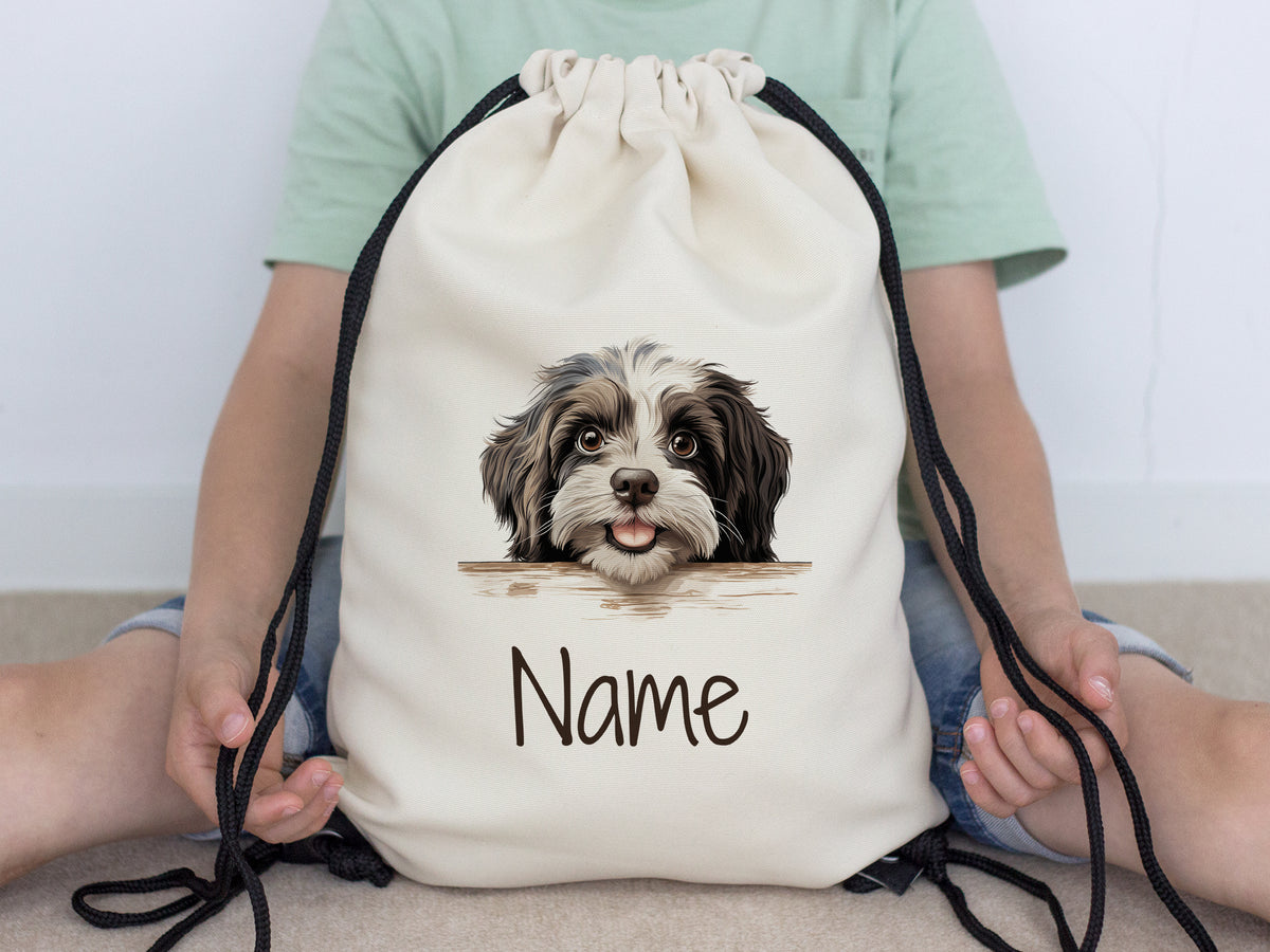 Beige Rucksack mit Hundemotiv und personalisierbarem Namen.