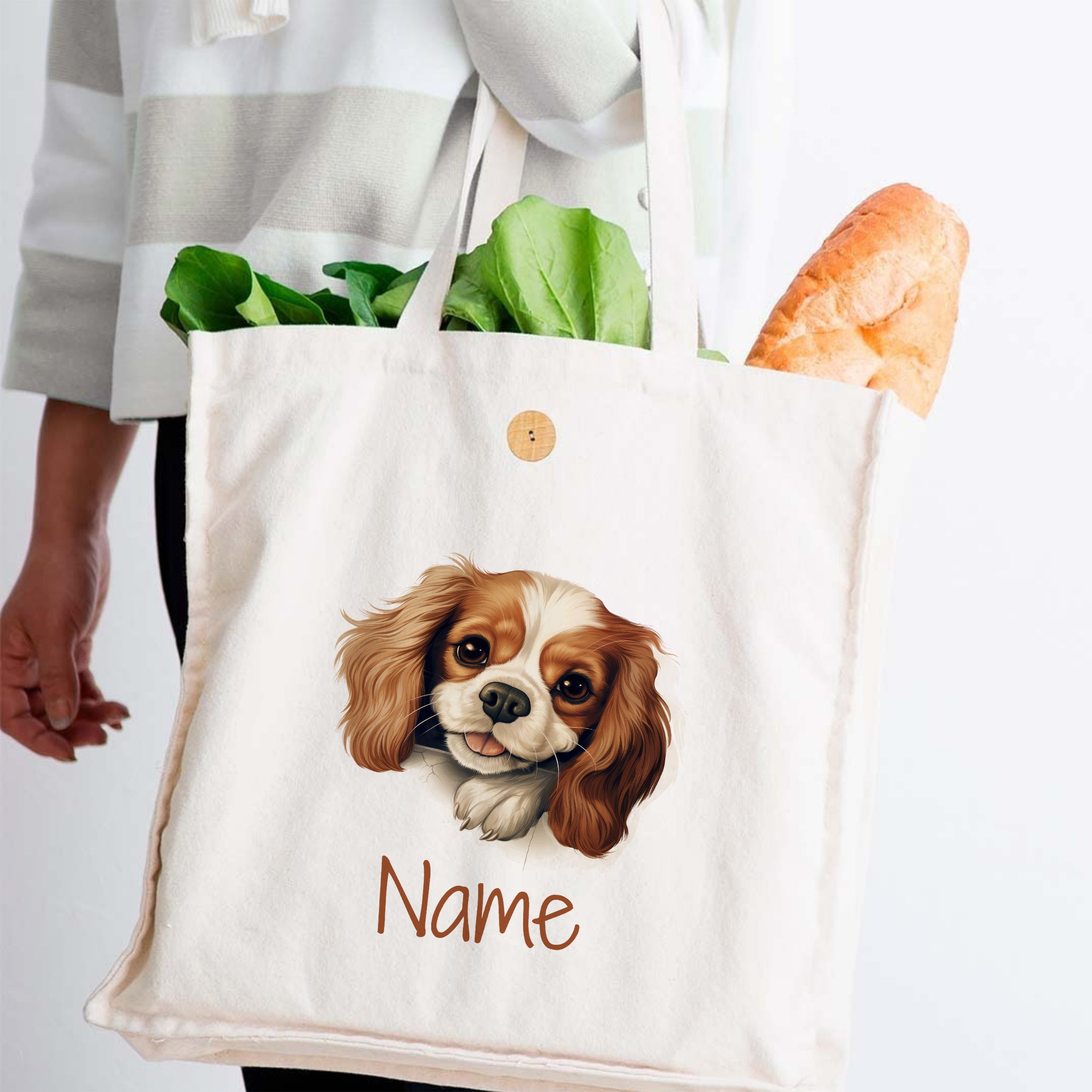 Beige Stofftasche mit Hundemotiv und personalisiertem Namen.