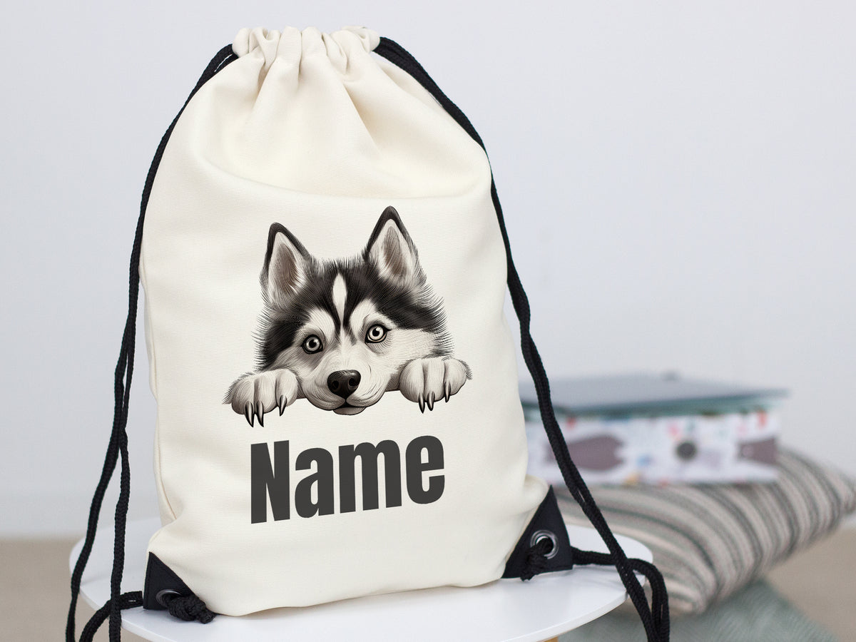 Beige Rucksack mit Husky-Motiv und personalisierbarem Namen.