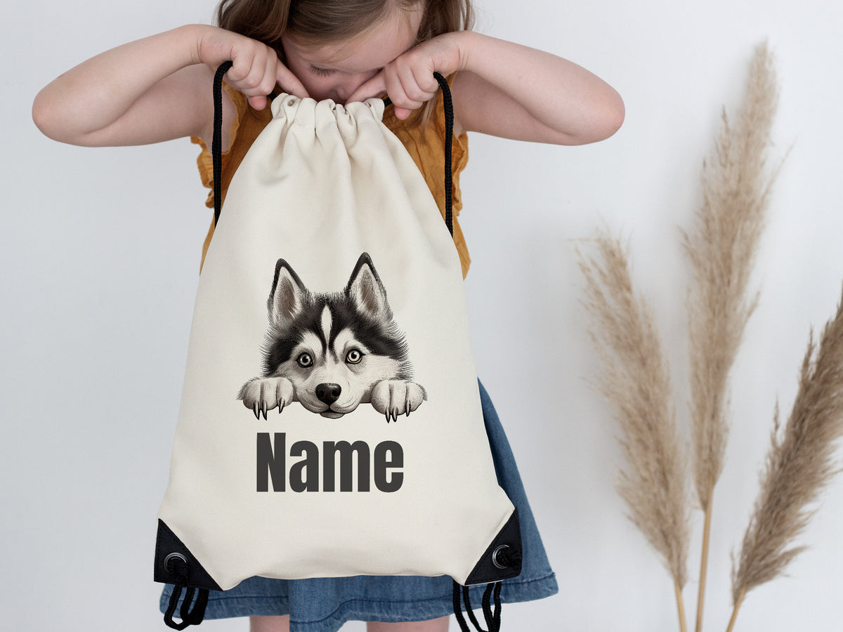 Beige Turnbeutel mit Husky-Motiv und personalisierbarem Namen.