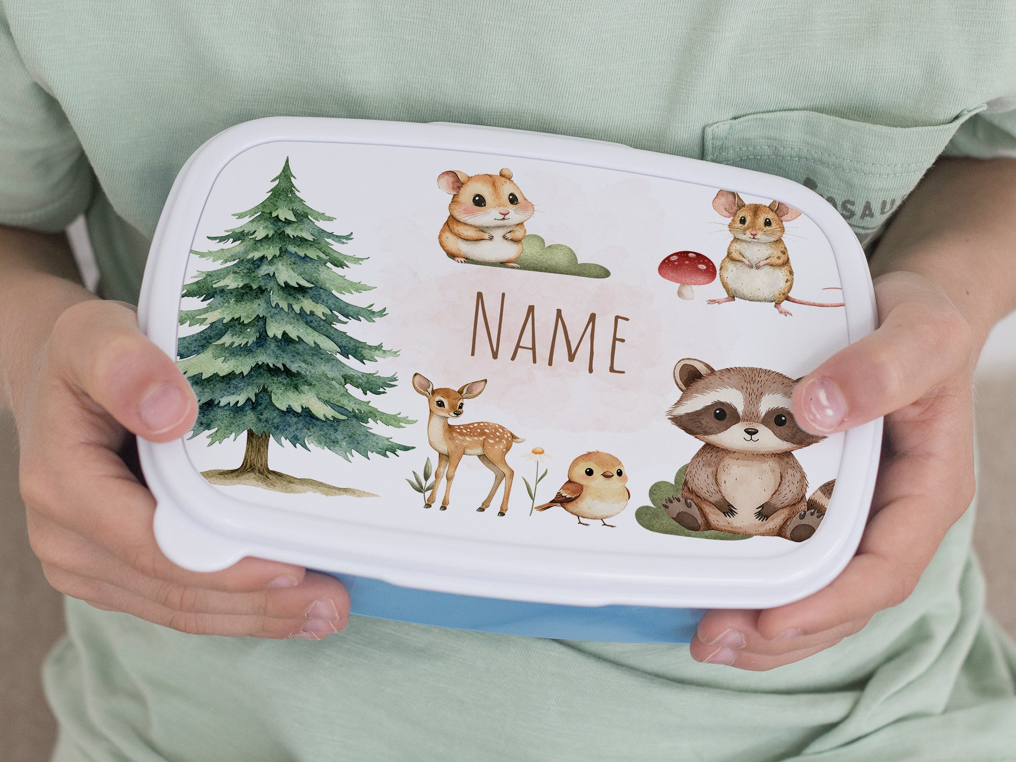 Bunte Brotdose mit Tiermotiven und personalisierbarem Namen.