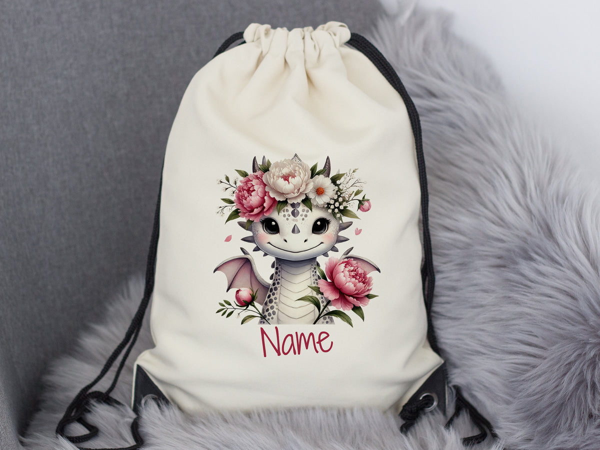 Beige Rucksack mit Drachenmotiv und Blumen, personalisierbar.