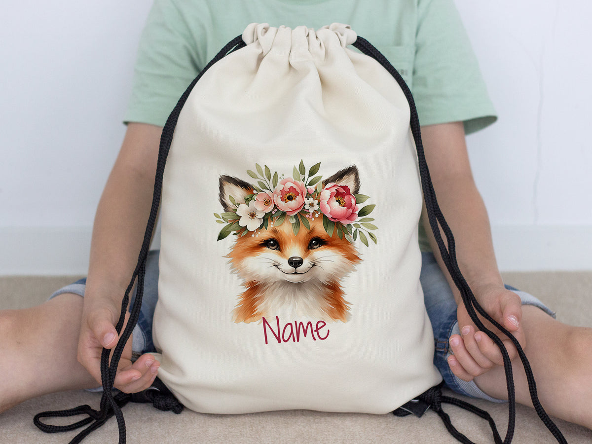 Beiger Rucksack mit Fuchs-Motiv und Blumenkranz.