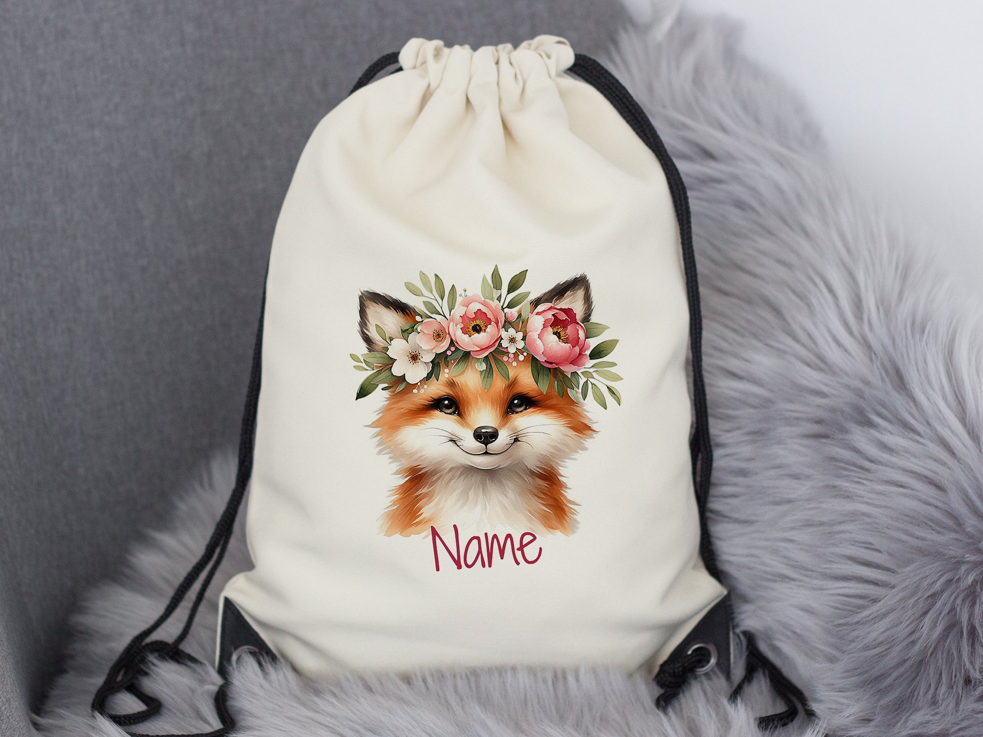 Beiger Rucksack mit Fuchs-Motiv und Blumenkranz.
