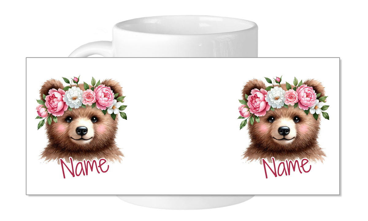 Tasse mit zwei Bärenköpfen und Blumenkranz.