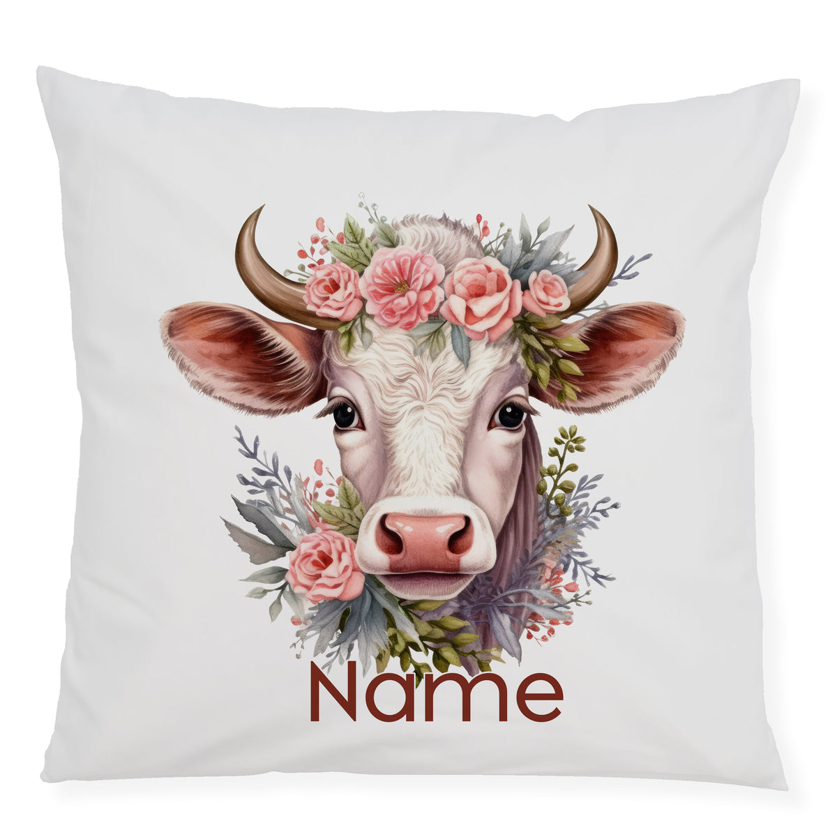 Kissen mit Kuhkopf, Blumenkranz und personalisiertem Namen.
