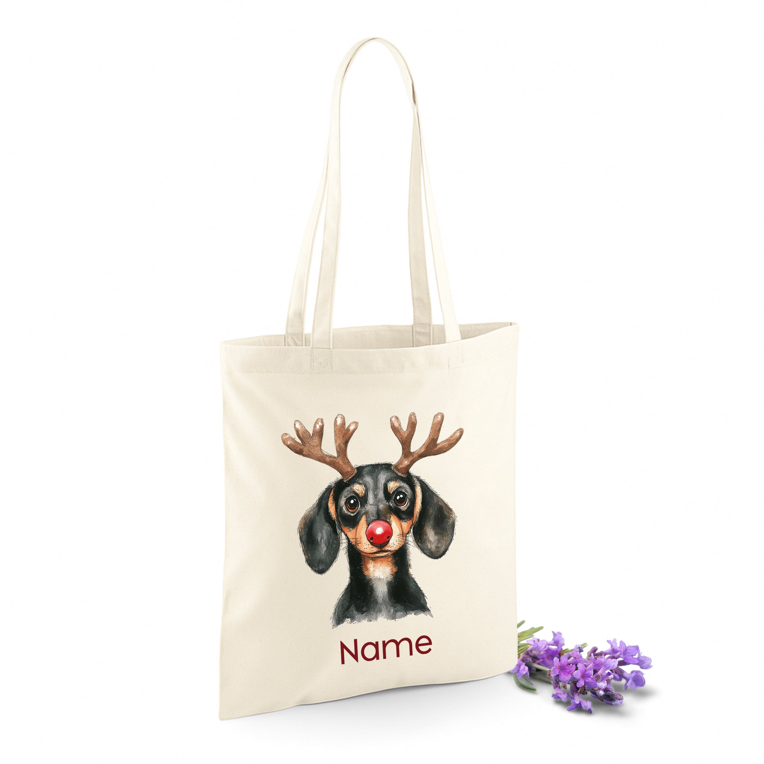 Beige Tasche mit Dackel, Rentiergeweih und personalisierbarem Namen.