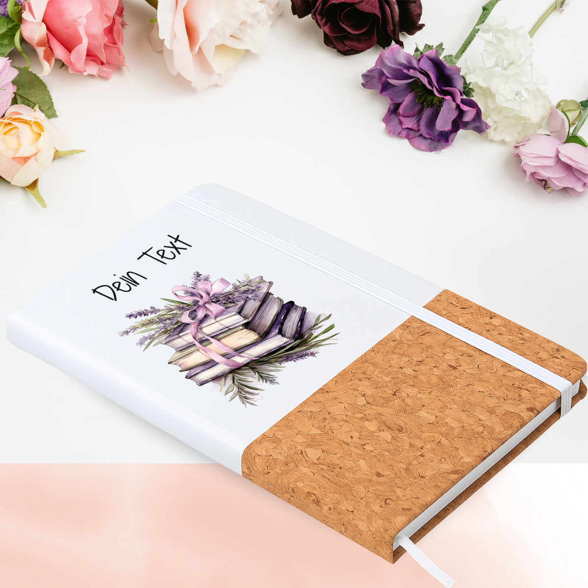 Notizbuch mit Buchmotiv in Blumenarrangement
