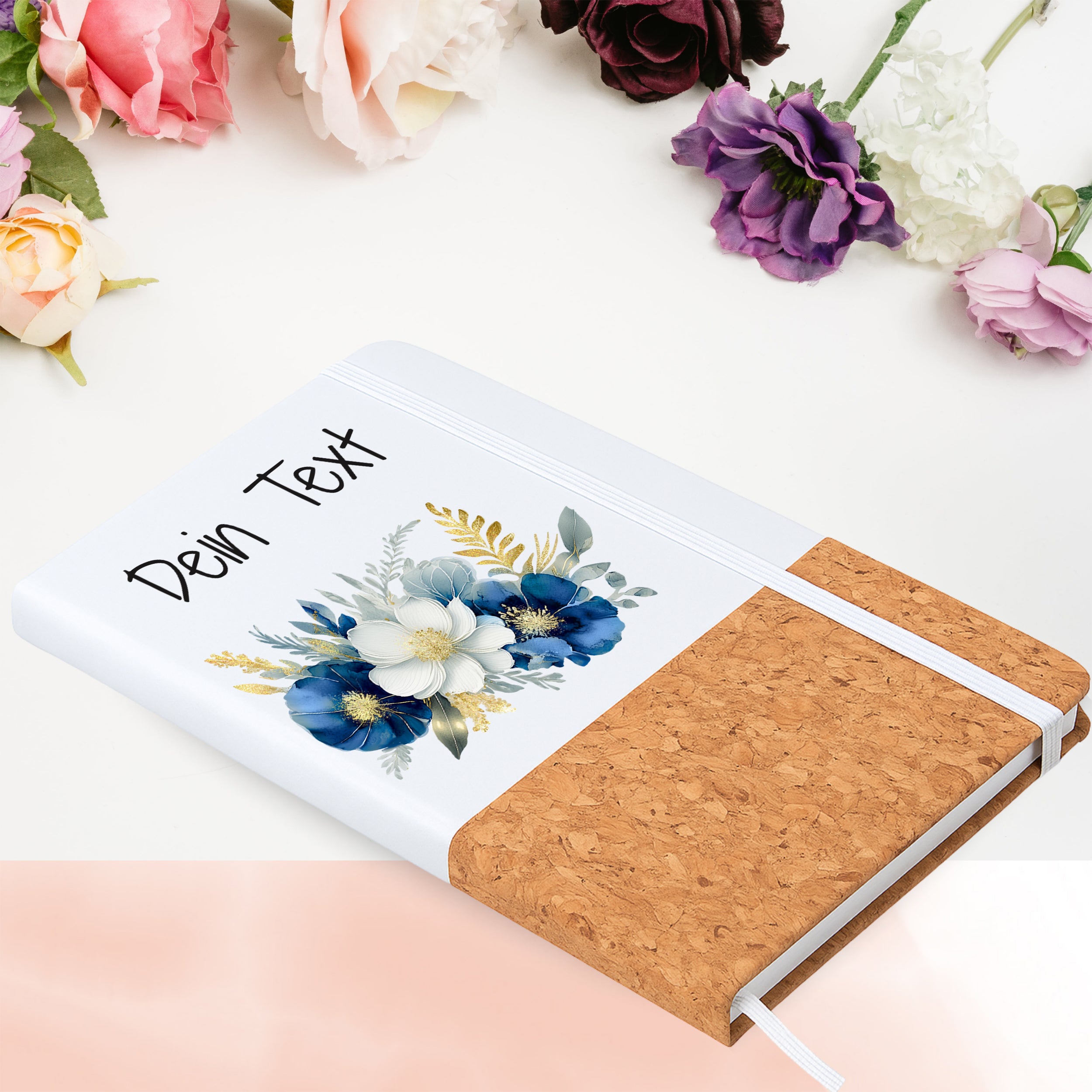 Notizbuch mit Blumenmotiv in Blumenarrangement
