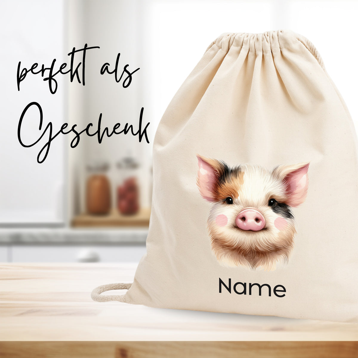 Beige Stoffbeutel mit Schwein-Motiv und personalisierbarem Namen.