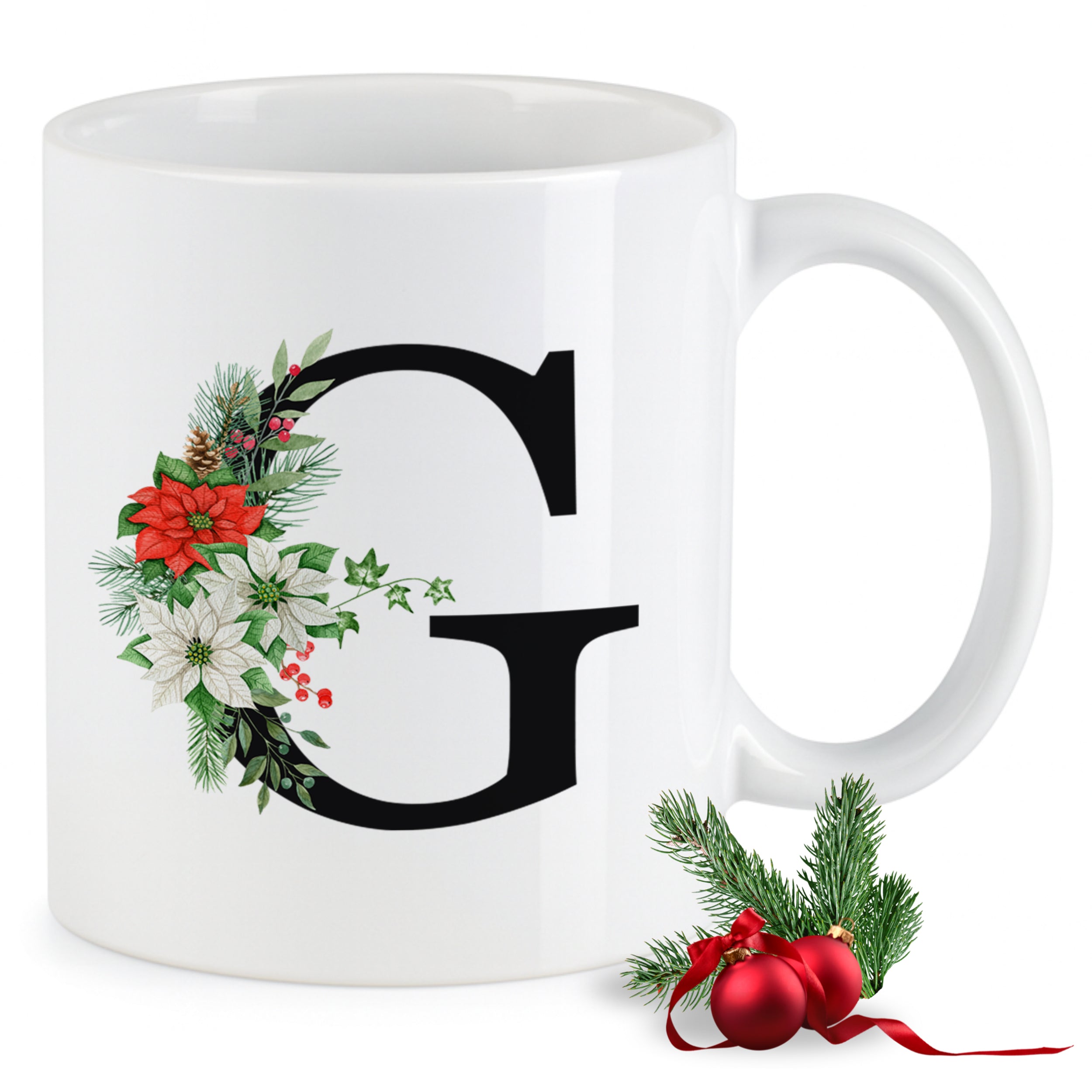Weißer Becher mit floralem Initial "G" und Weihnachtsmotiven.