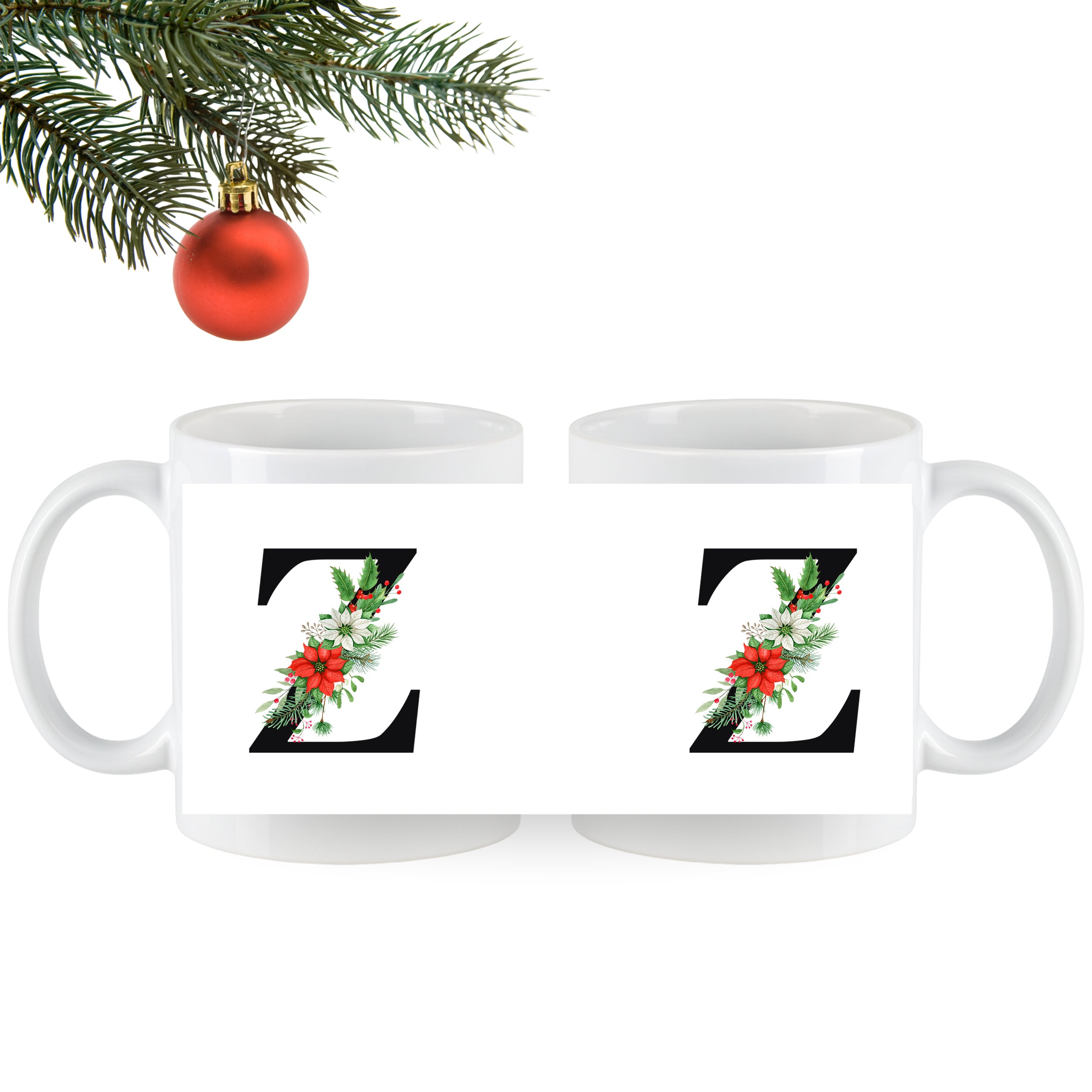 Weiße Tassen mit schwarzem "Z" und Weihnachtsdekor.